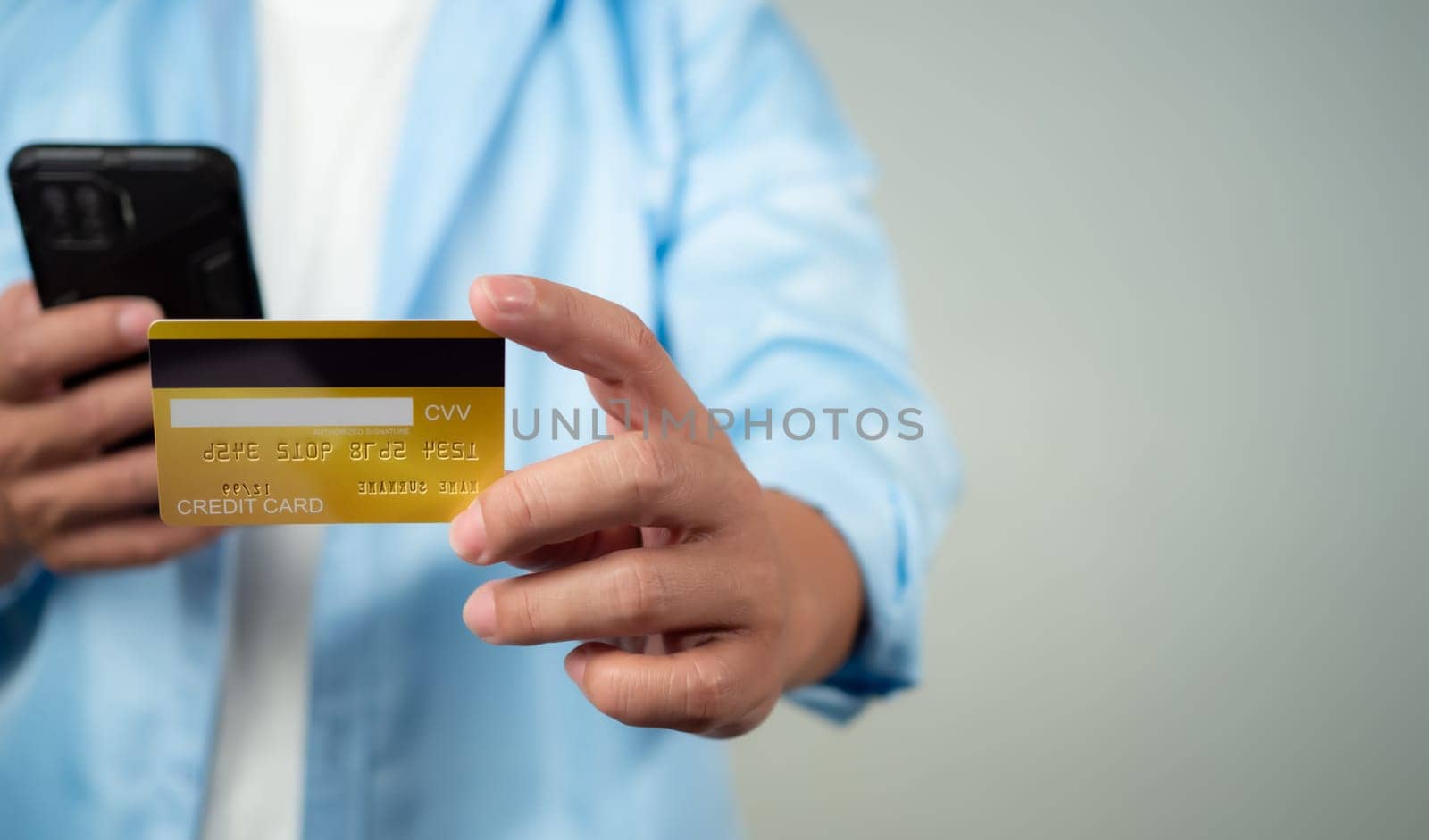 Online payment, Man using mobile smartphone and credit card for online shopping, Digital online payment concept, Technology online banking applications via internet network, financial transaction.