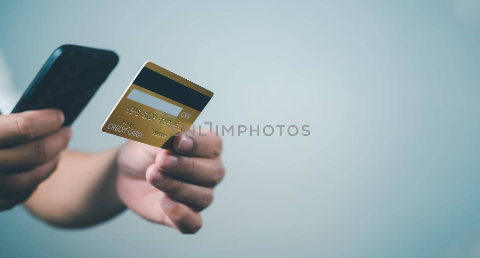 Online payment, Man using mobile smartphone and credit card for online shopping, Digital online payment concept, Technology online banking applications via internet network, financial transaction.