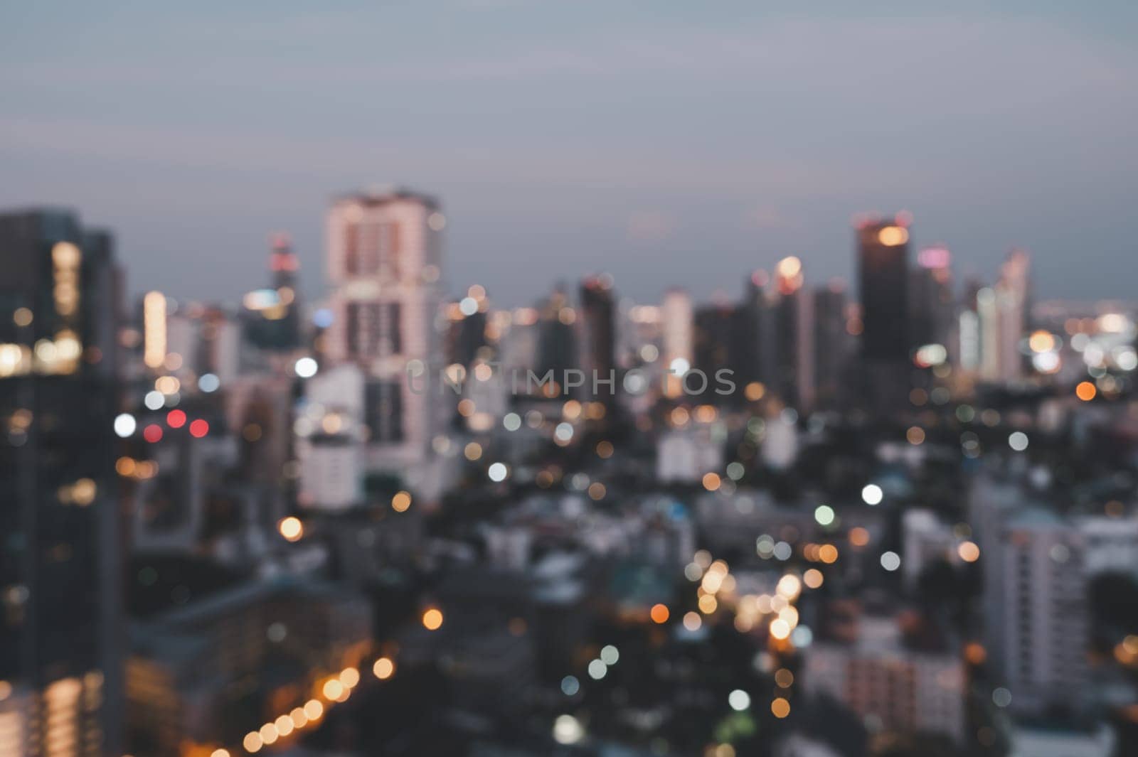 Cityscape blurred abstract background with bokeh urban lights in retro process effect