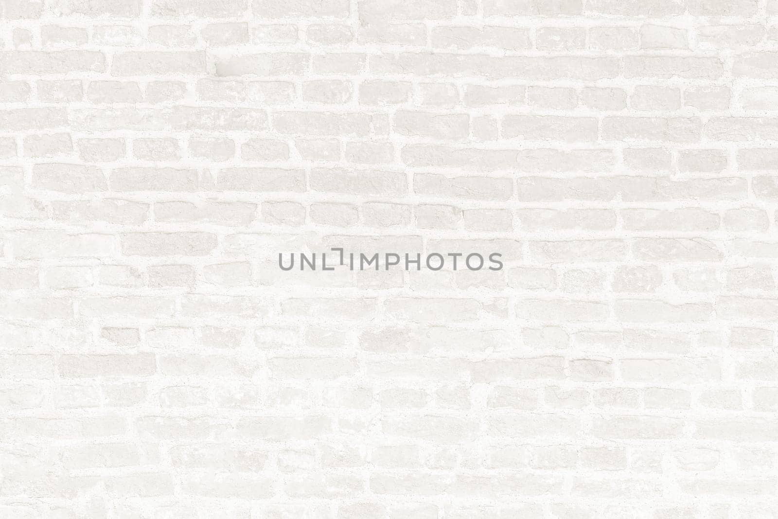Background image of a white old brick wall in close-up.Texture or background