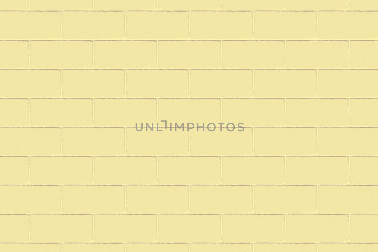Background image of a wide decorative yellow brick wall in close-up