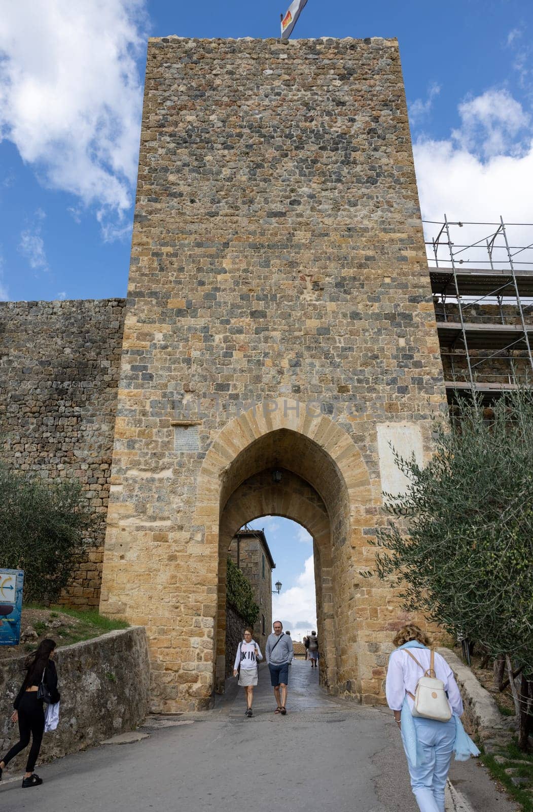 Monteriggioni, Italy - Sept 17, 2022: Porta Franca, city gate in Monteriggioni medieval walled town near Siena in Tuscany, Italy