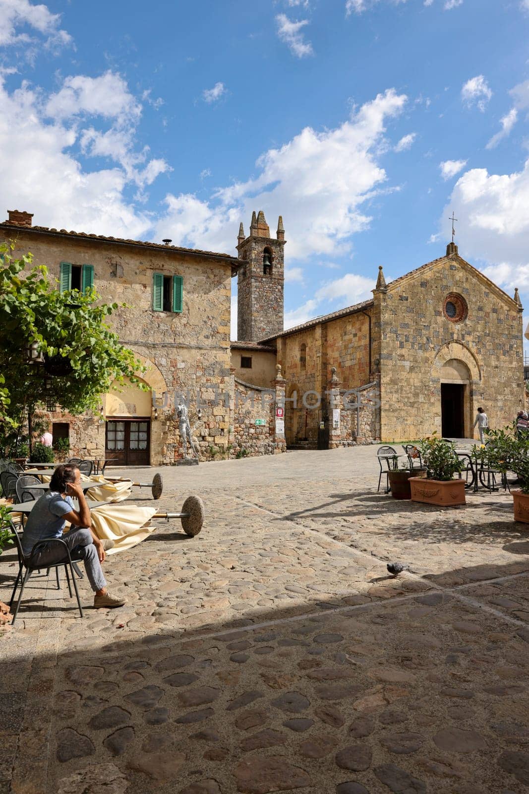 Monteriggioni, Italy - Sept 17, 2022: Piazza Roma in Monteriggioni medieval walled town. Tuscany, Italy