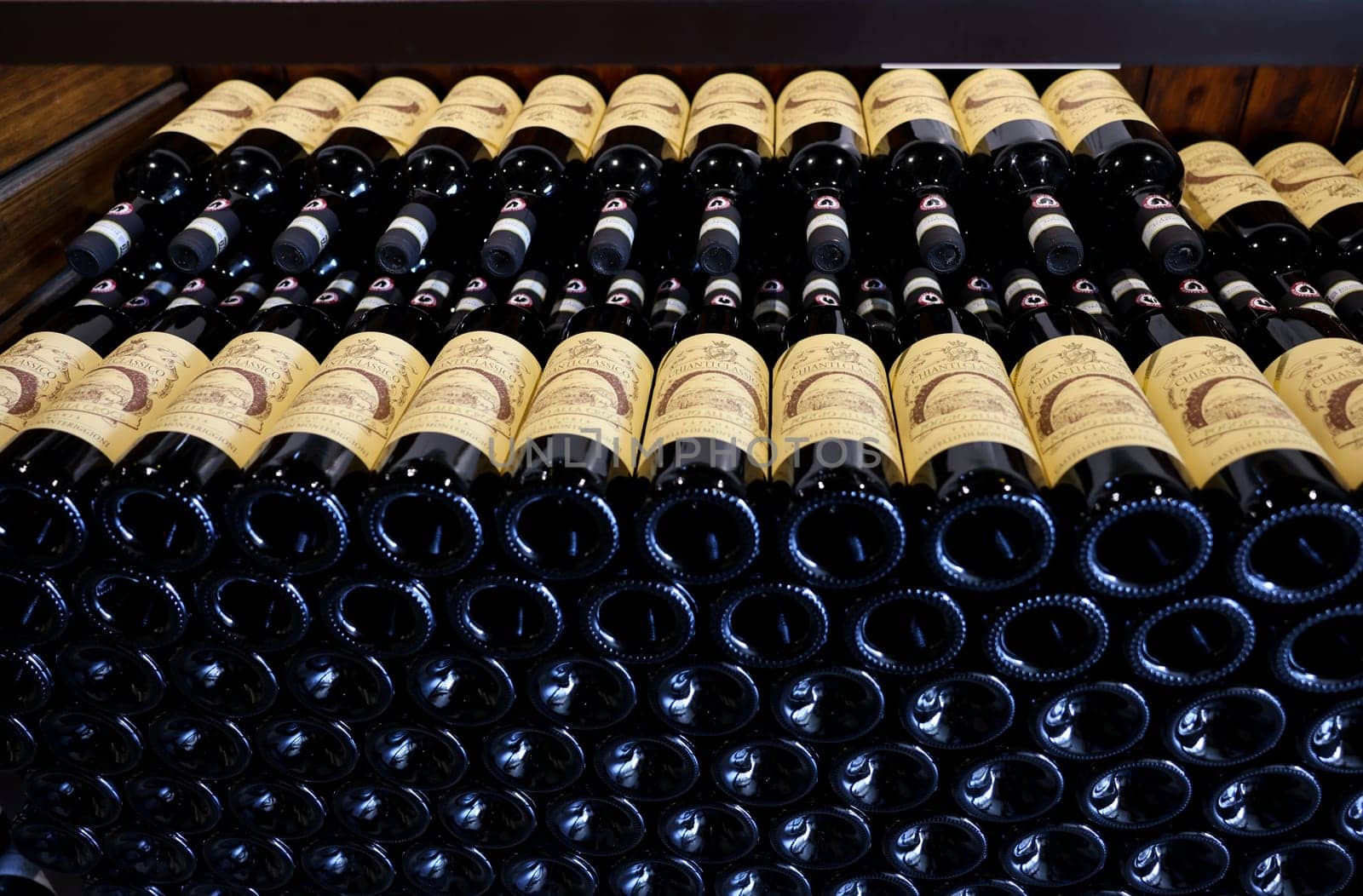 Monteriggioni, Italy - Sept 17, 2022: Neatly arranged bottles of Chianti Classico wine in a wine shop in Monteriggioni near Siena. Italy
