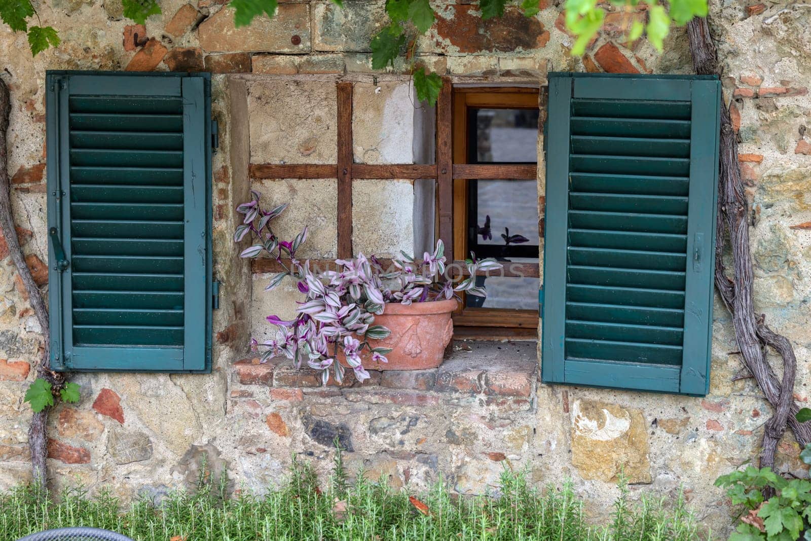 Monteriggioni, Italy - Sept 17, 2022: Old stone house in Monteriggioni medieval walled town near Siena in Tuscany, Italy