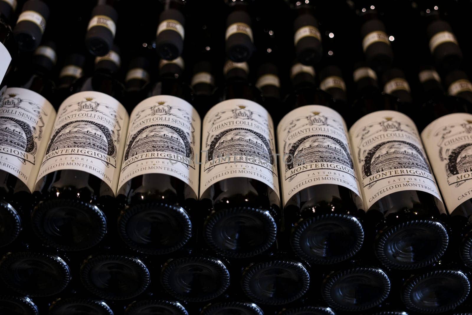 Monteriggioni, Italy - Sept 17, 2022: Neatly arranged bottles of Chianti Classico wine in a wine shop in Monteriggioni near Siena. Italy