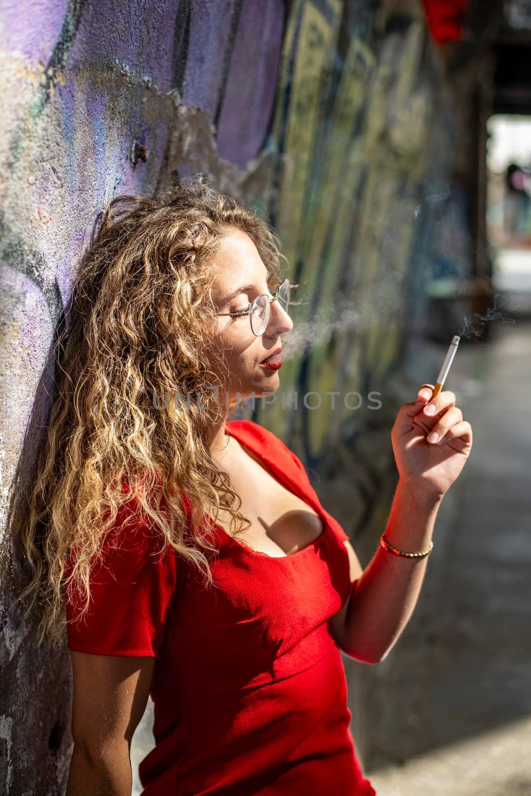 pensive young woman with cigarette