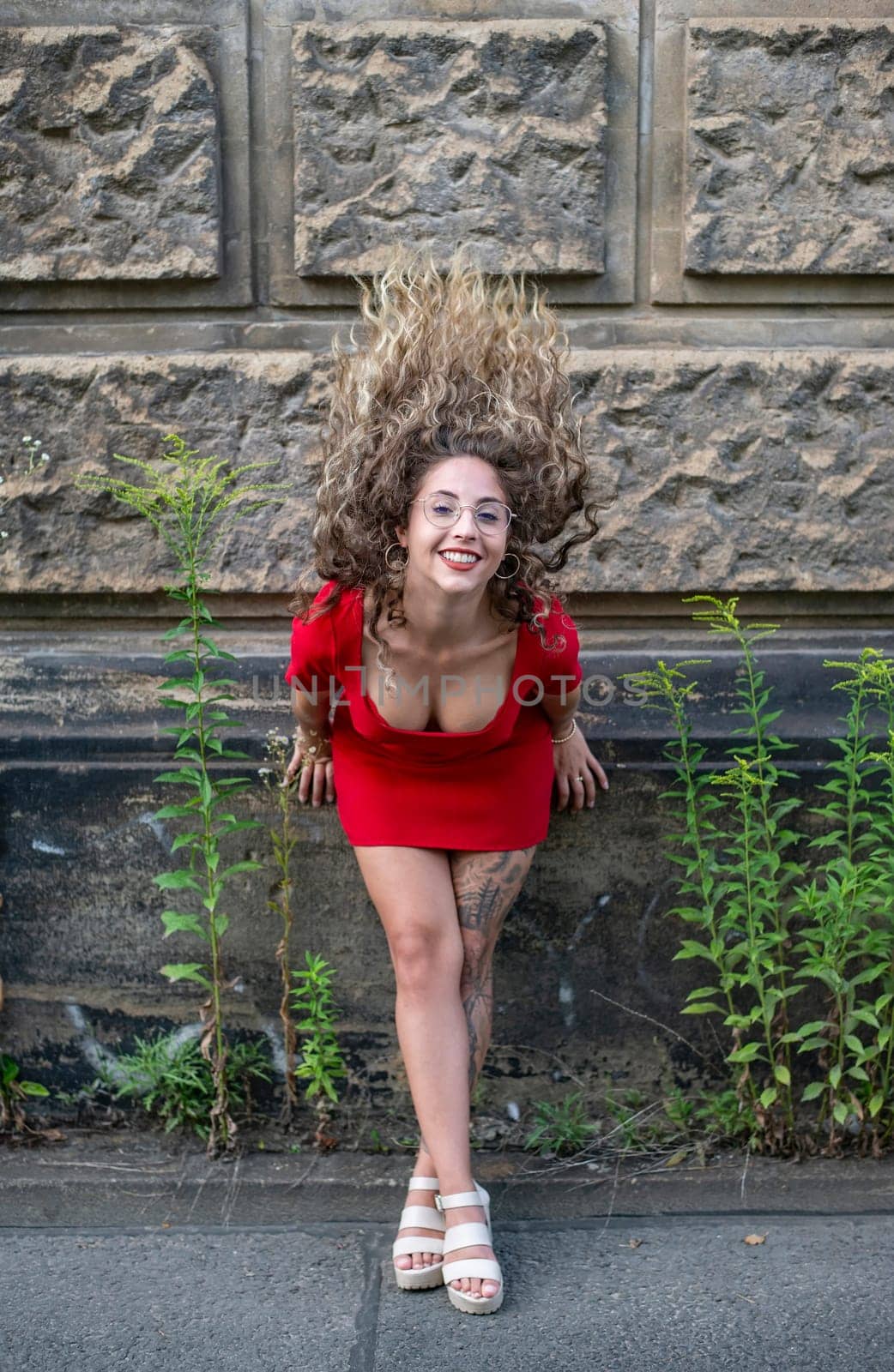 happy young woman with blowing hairs