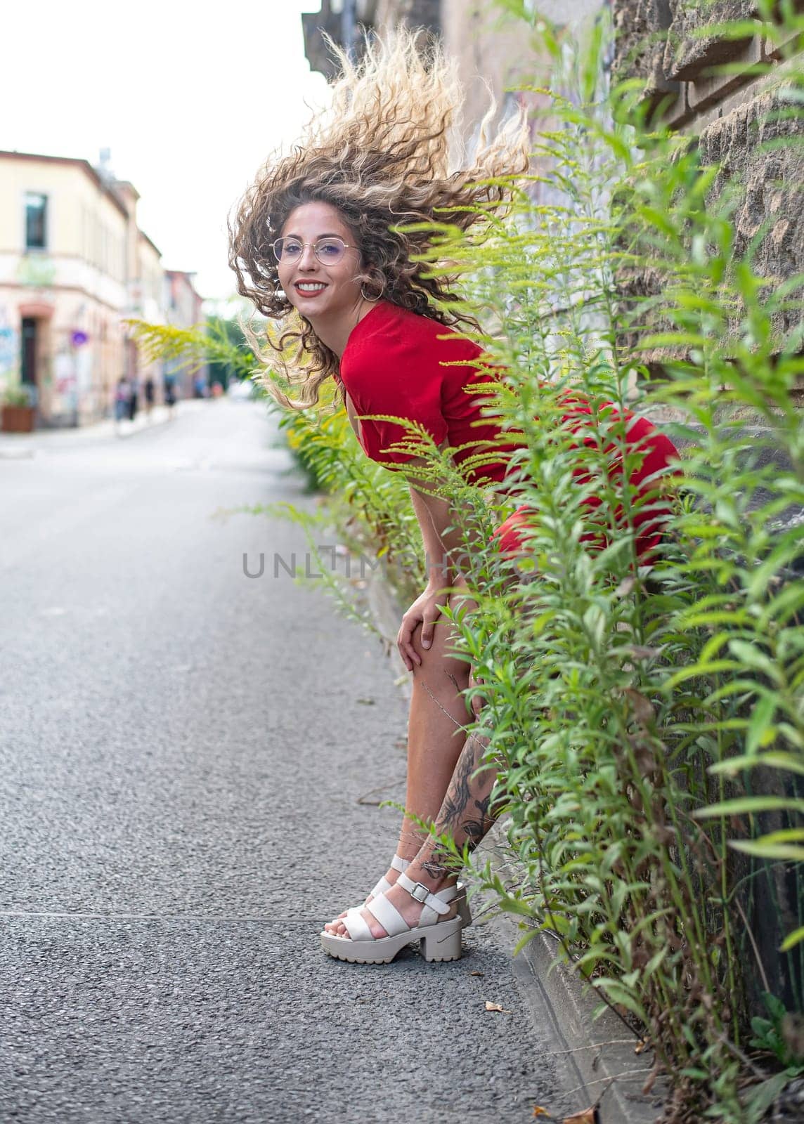 happy young woman with blowing hairs