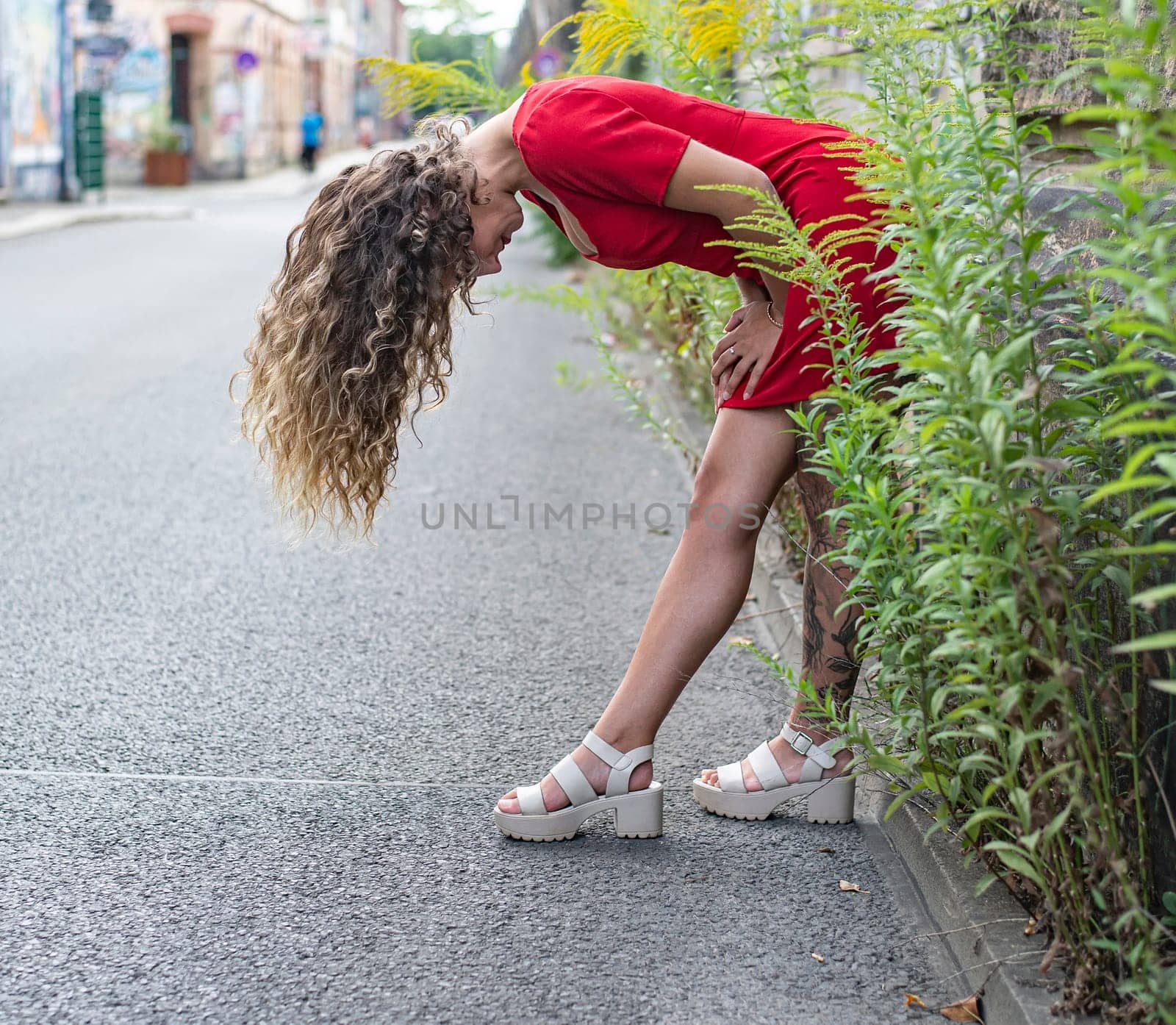 happy young woman with blowing hairs
