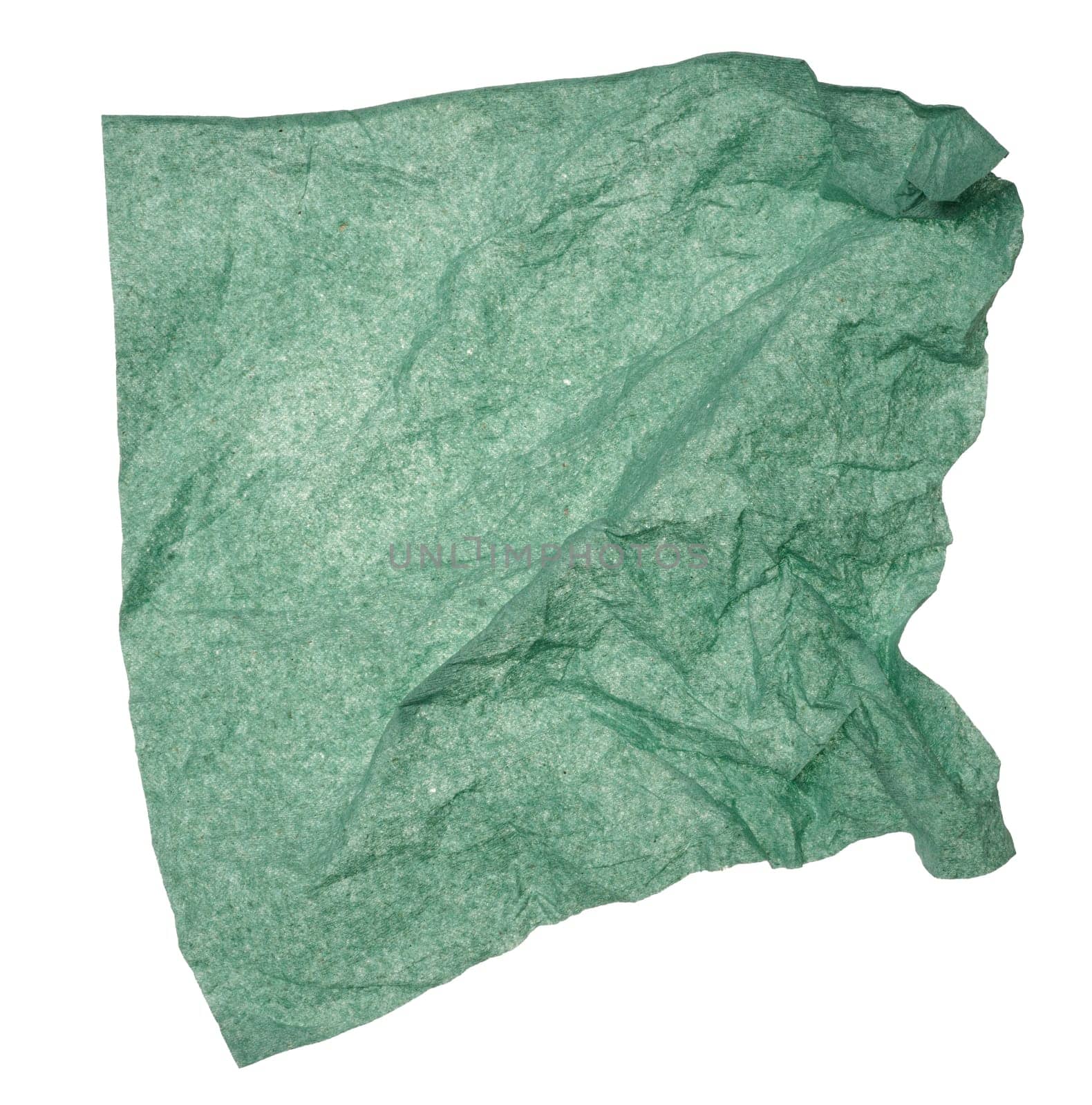 Green crumpled paper napkin on isolated background, close up