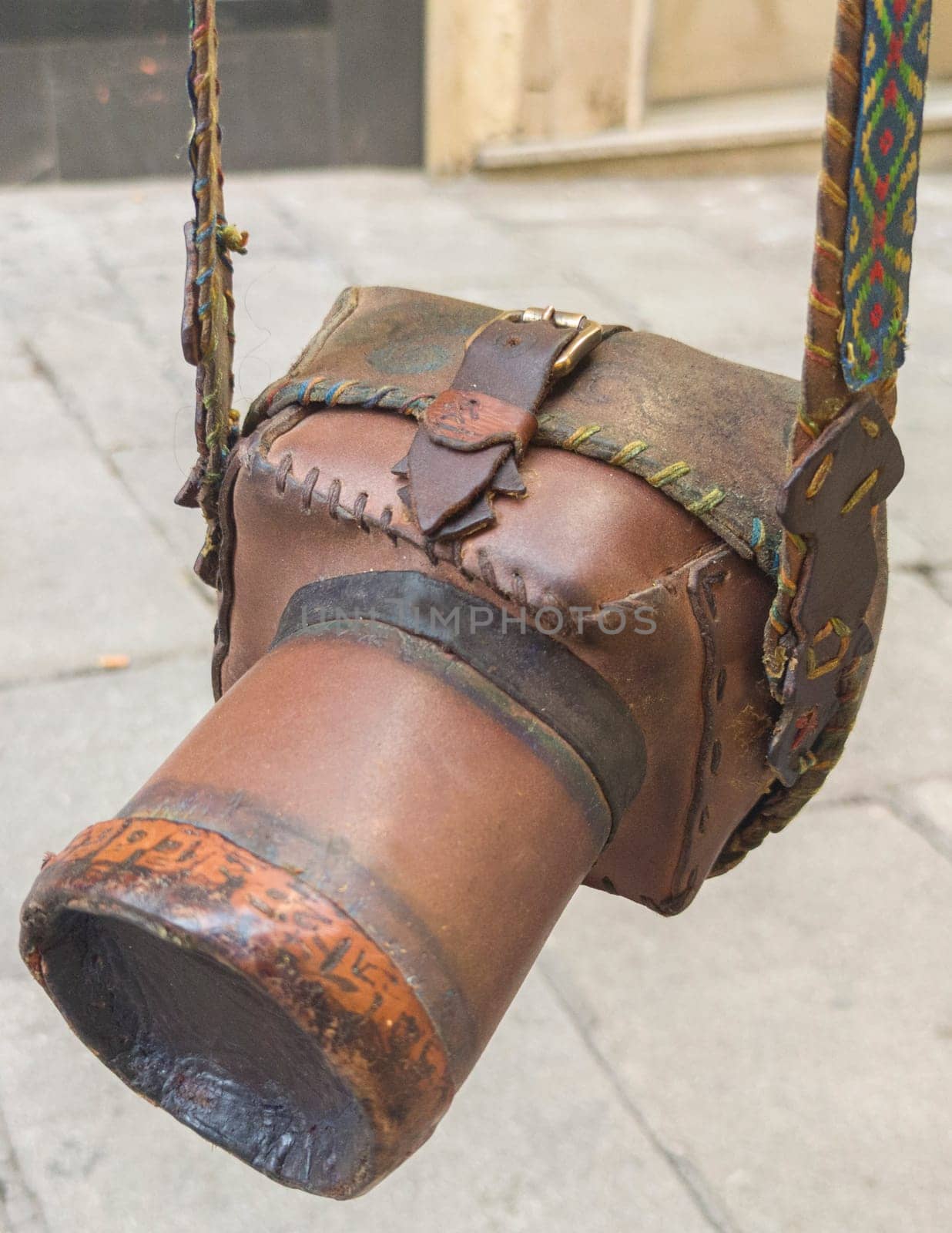 Rudimentary leather case for reflex camera. View hanging from its straps