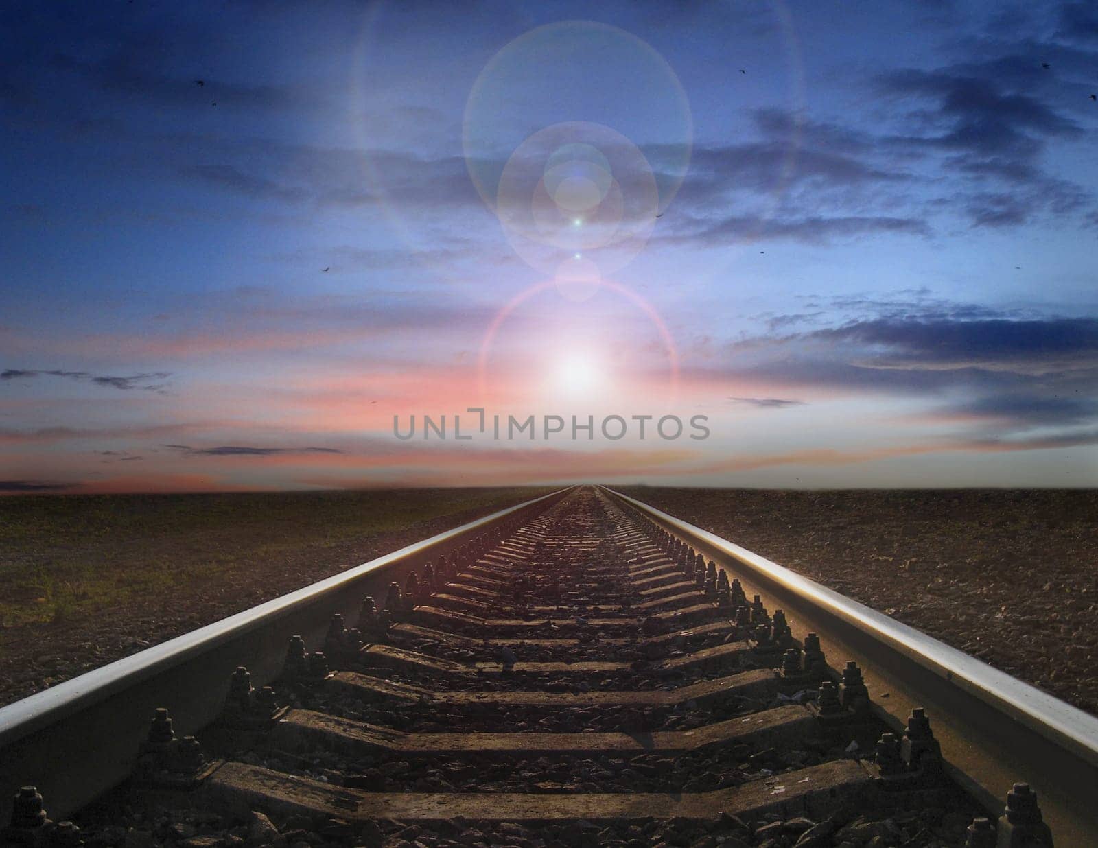 morning sun rising over the railway tracks. Sunrise on road. road to bright future. Hope for the best. Railway road and setting sun. Travel concept. Morning travel. Rails with natural landscape