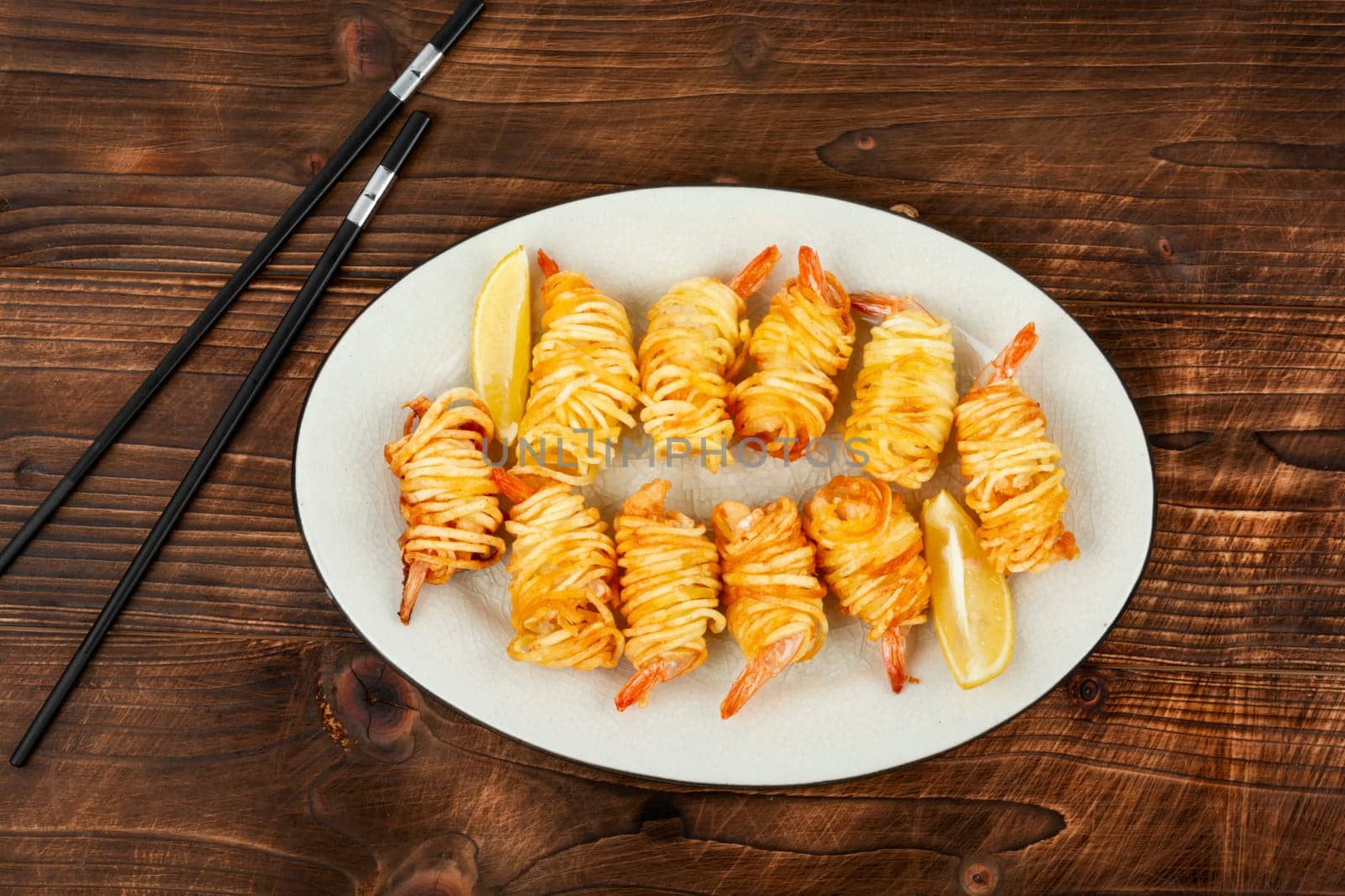 Fried rolled potato shrimps, prawns and potato rolls. Popular Asian food. Vietnamese cuisine. Space for text.