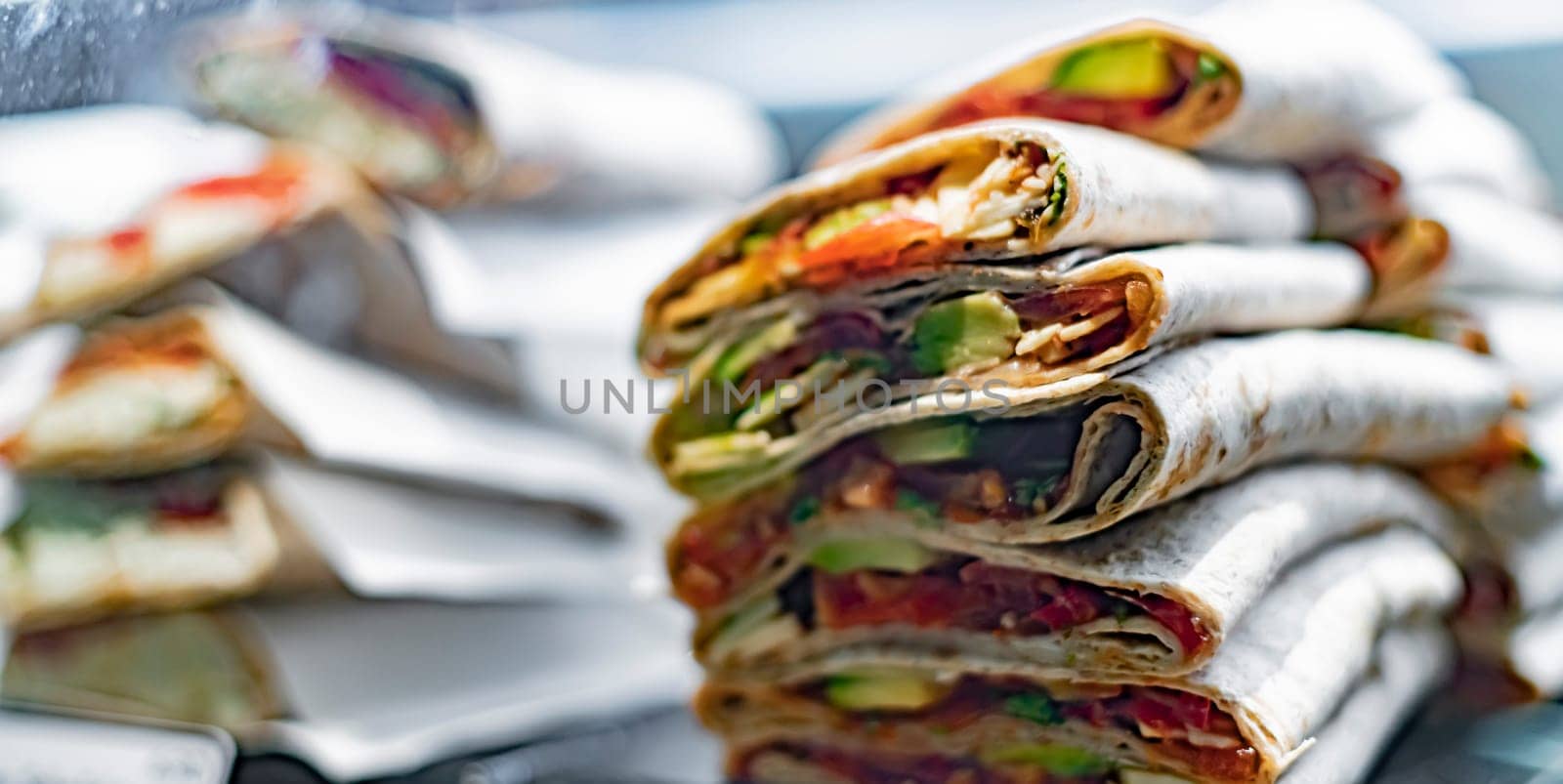 Freshly prepared tortilla wraps sold in a fast food restaurant.