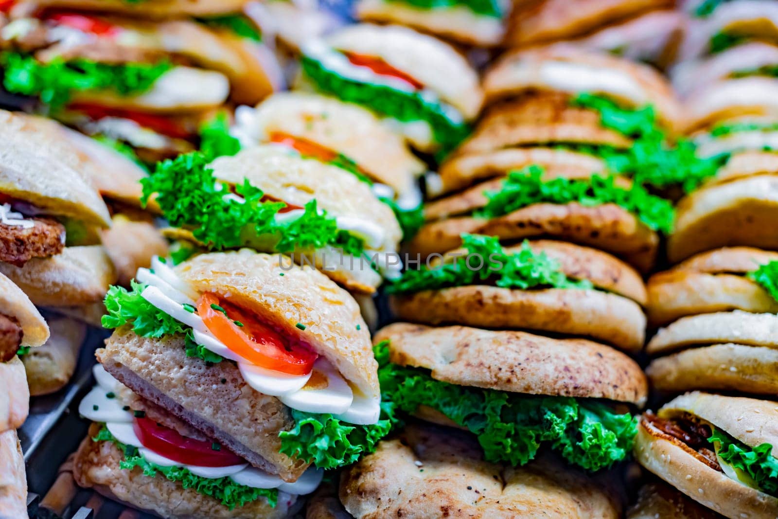 Freshly prepared sandwiches sold in a fast food restaurant.