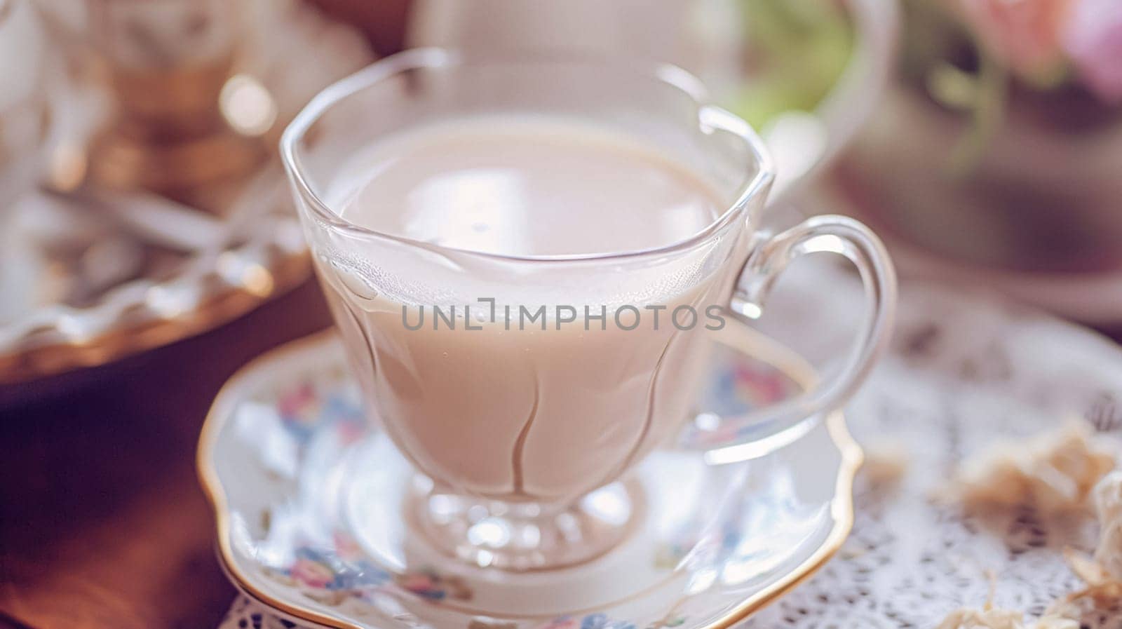 Elegant table setting for tea party with cakes and cupcakes in English manor. Selective focus. Vintage style