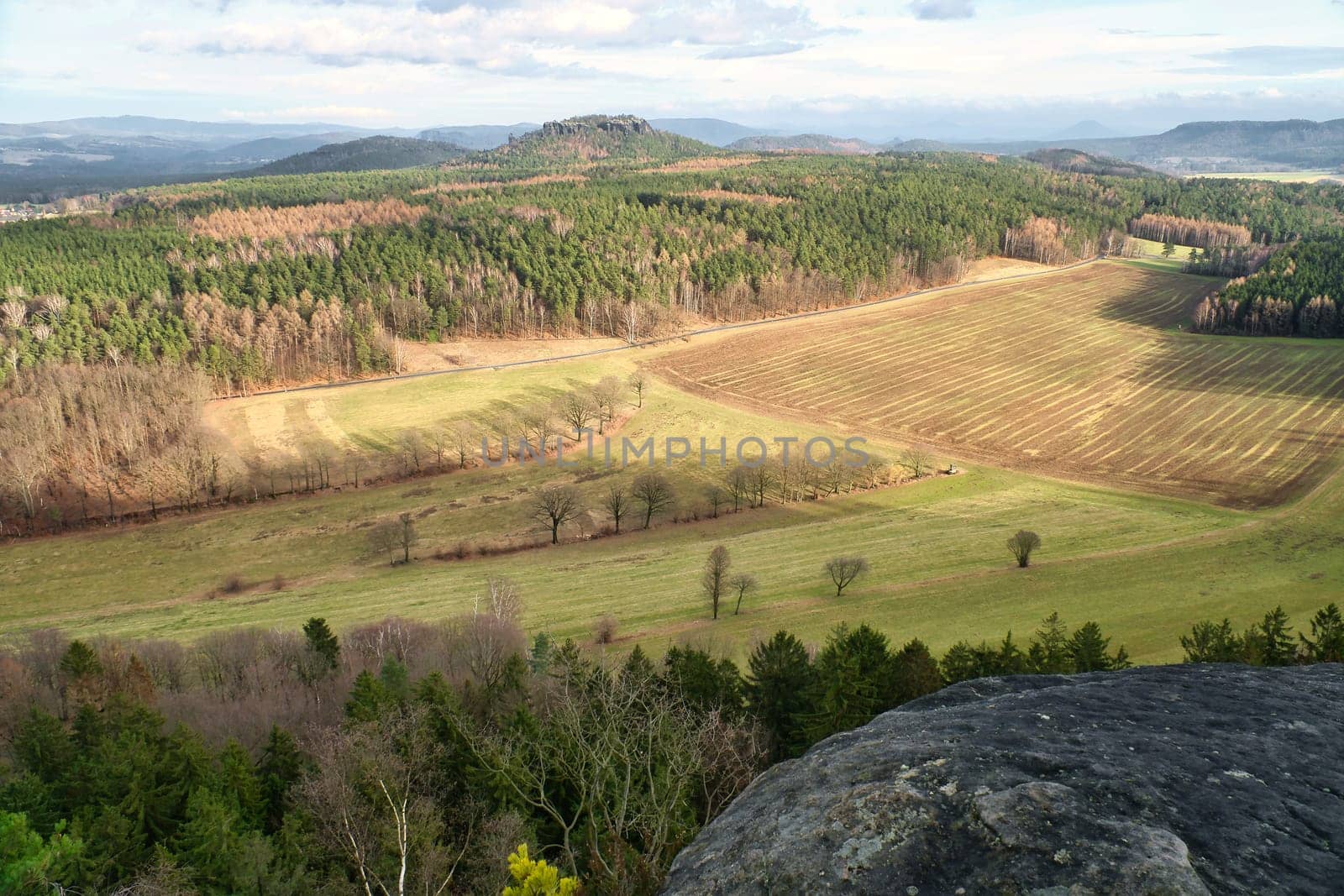 View from the Pfaffenstein. Forests, mountains, fields, vastness, panorama. Landscape from the Elbe Sandstone Mountains.