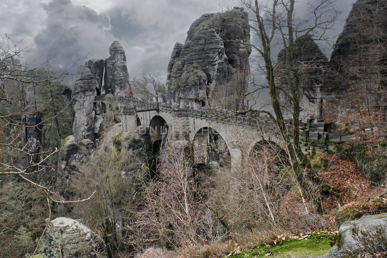 The Bastei Bridge in Saxon Switzerland. jagged rocks, viewing platform overlooking the Elbe. Tourist attraction. Dramatic sky. National park in Germany