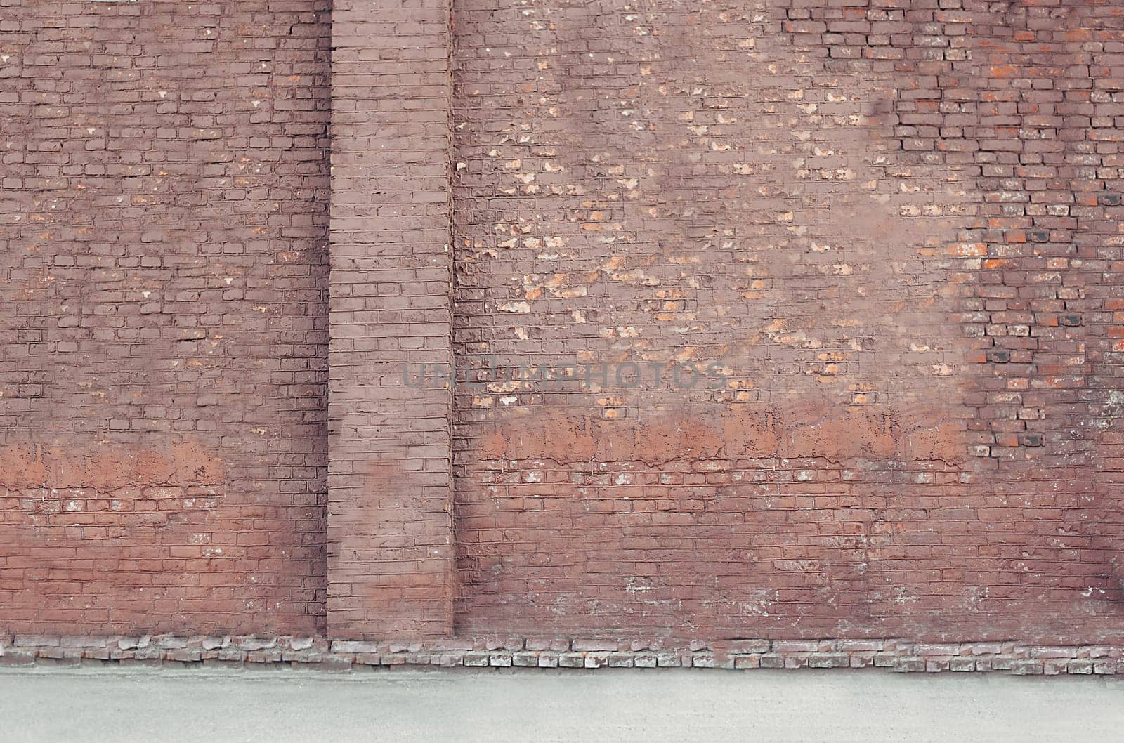 Background texture of an old faded red brick wall with a place for text