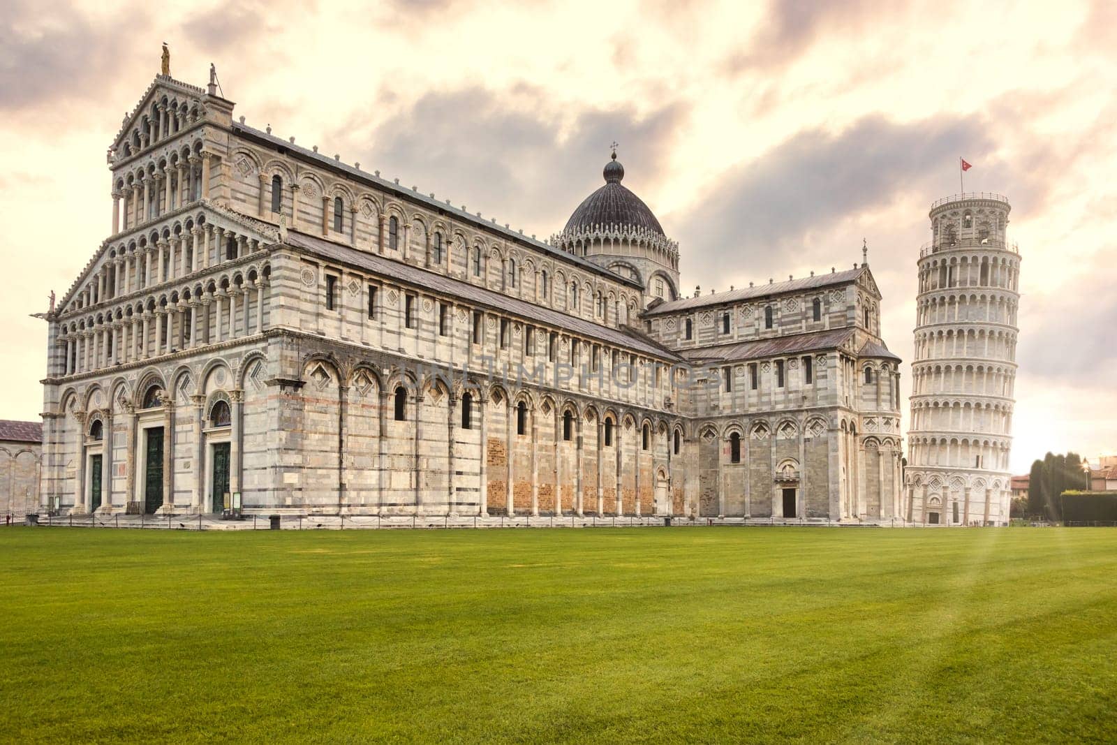 Pisa, Italy - 29 June 2023: cathedral sightseeing, travel destination, sunrise light, famous artistic building