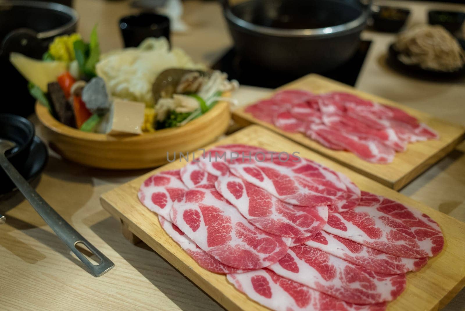 Slice of fresh beef at hot pot restaurant