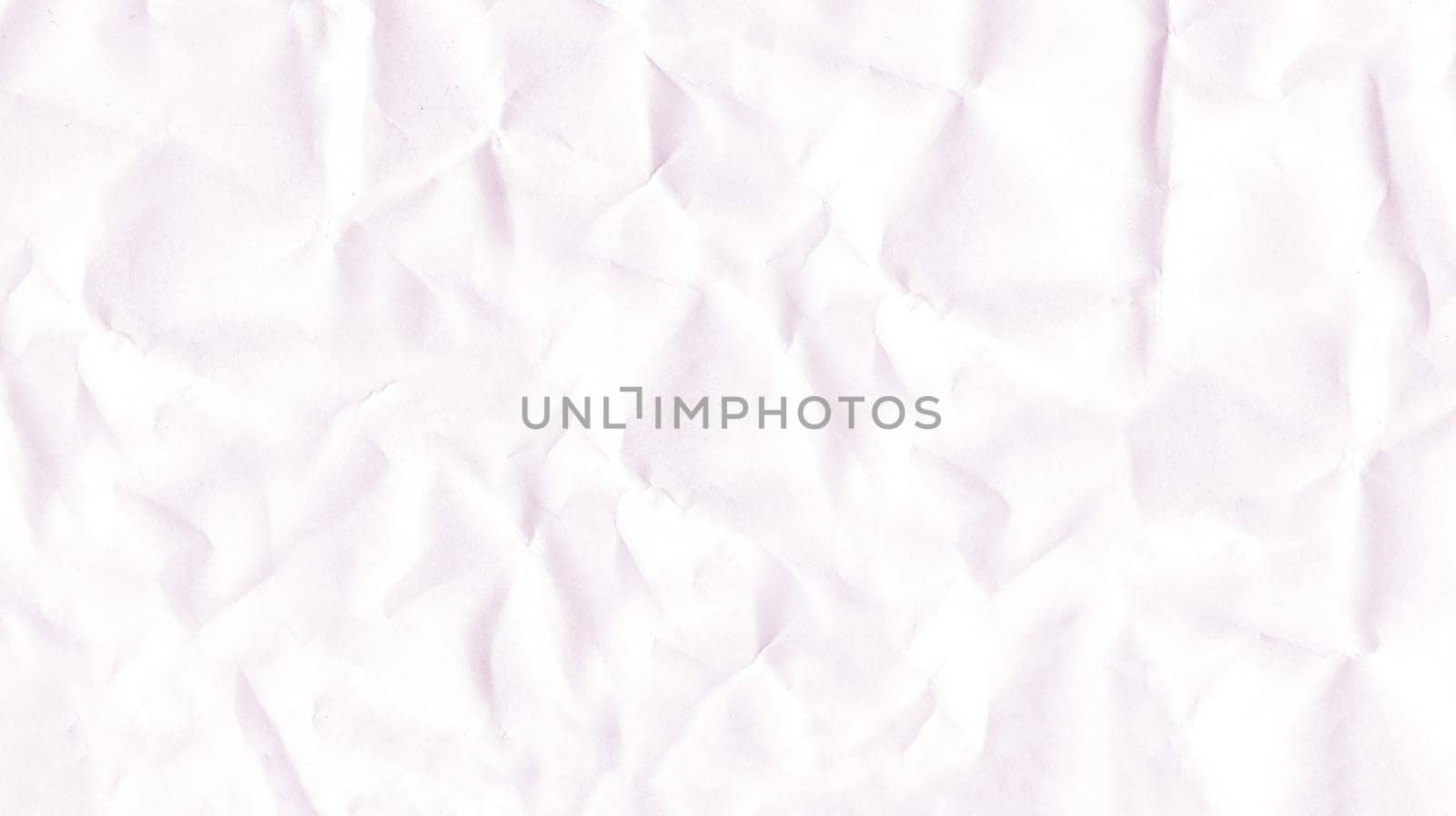 Background image of an old heavily crumpled white paper in close-up