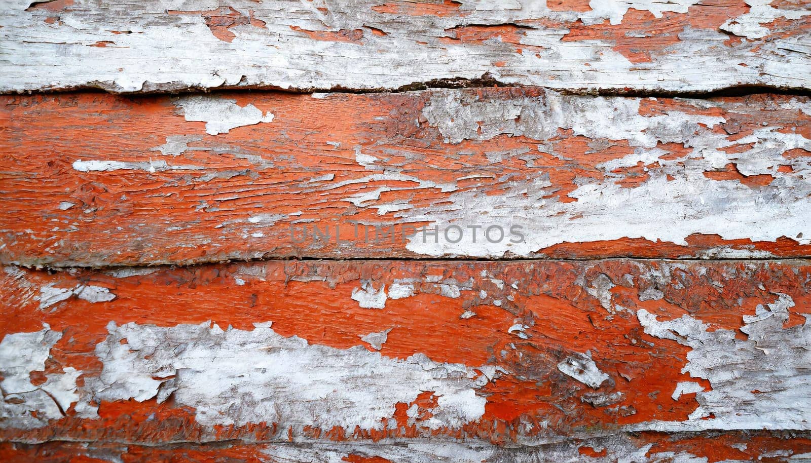 Light blue red and green weathered wooden background with cracked paint.