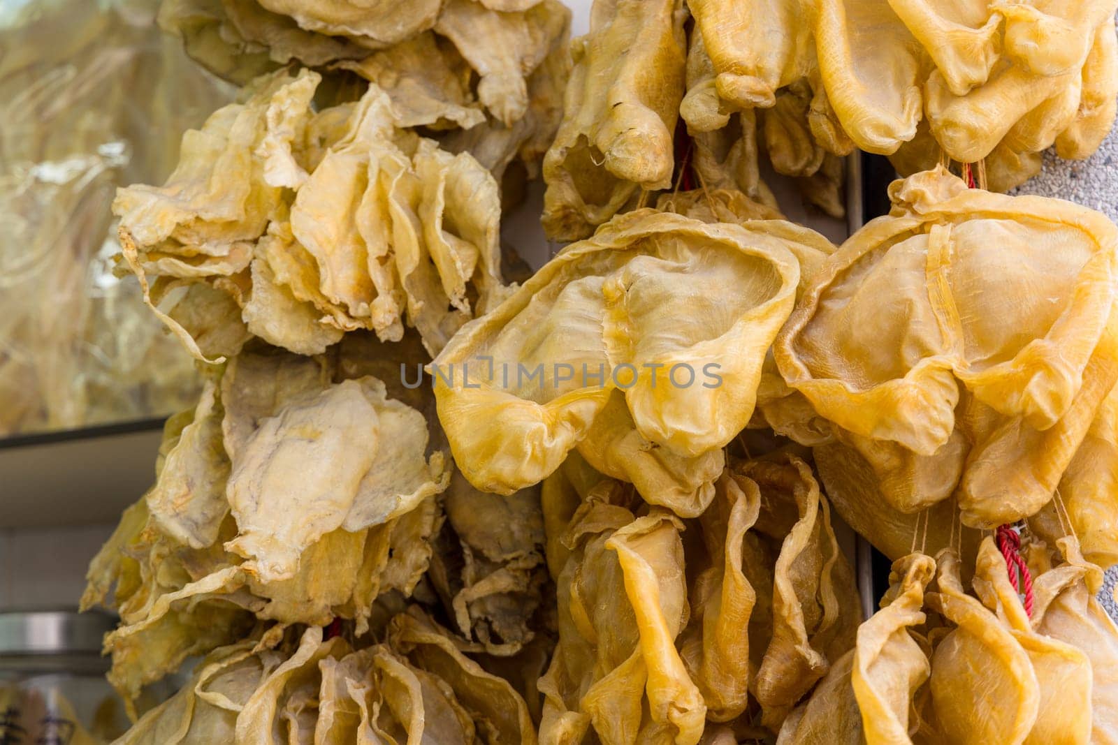 Dry fish maw hanging at the store for selling