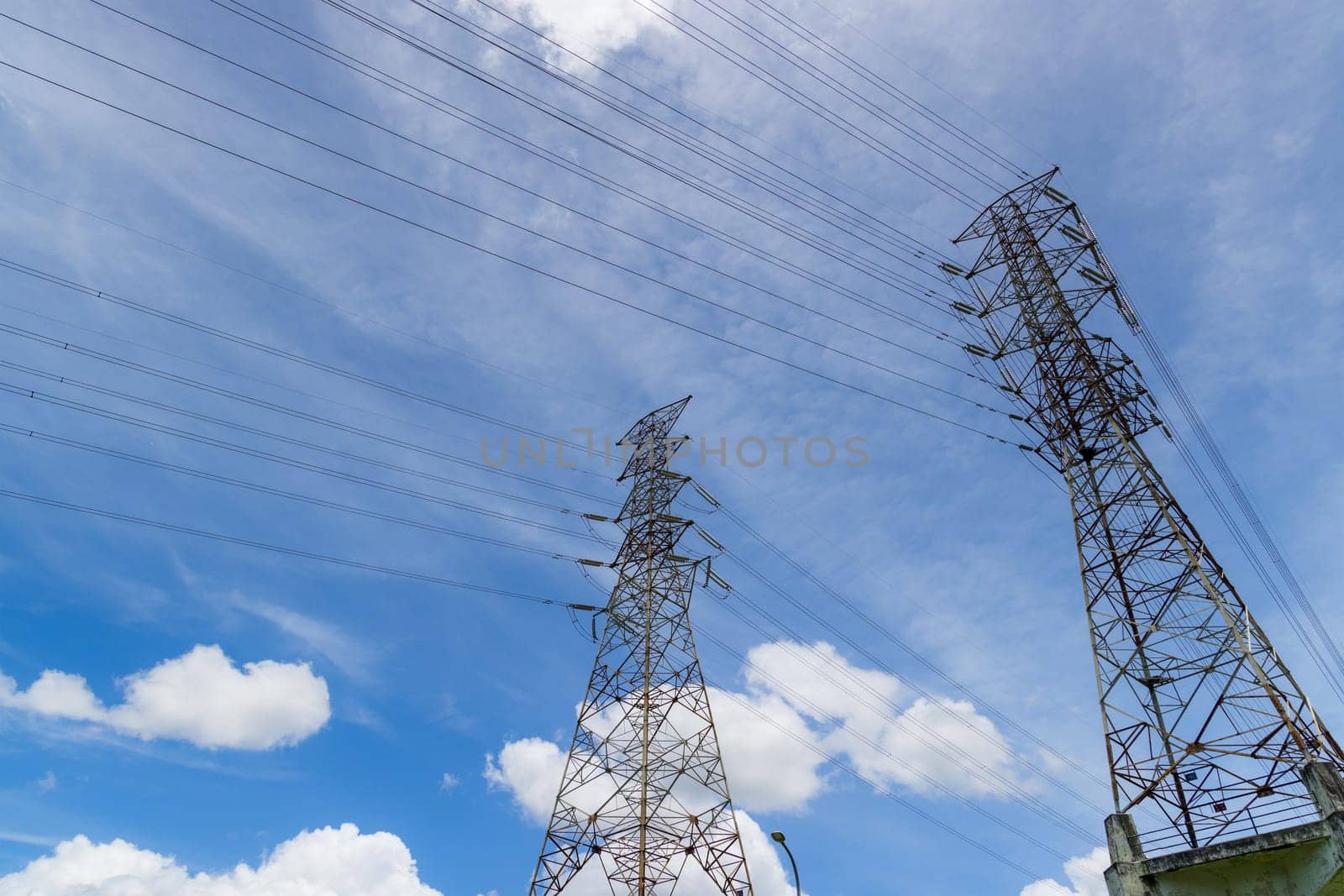 Pylon and high voltage powerline over the blue sky
