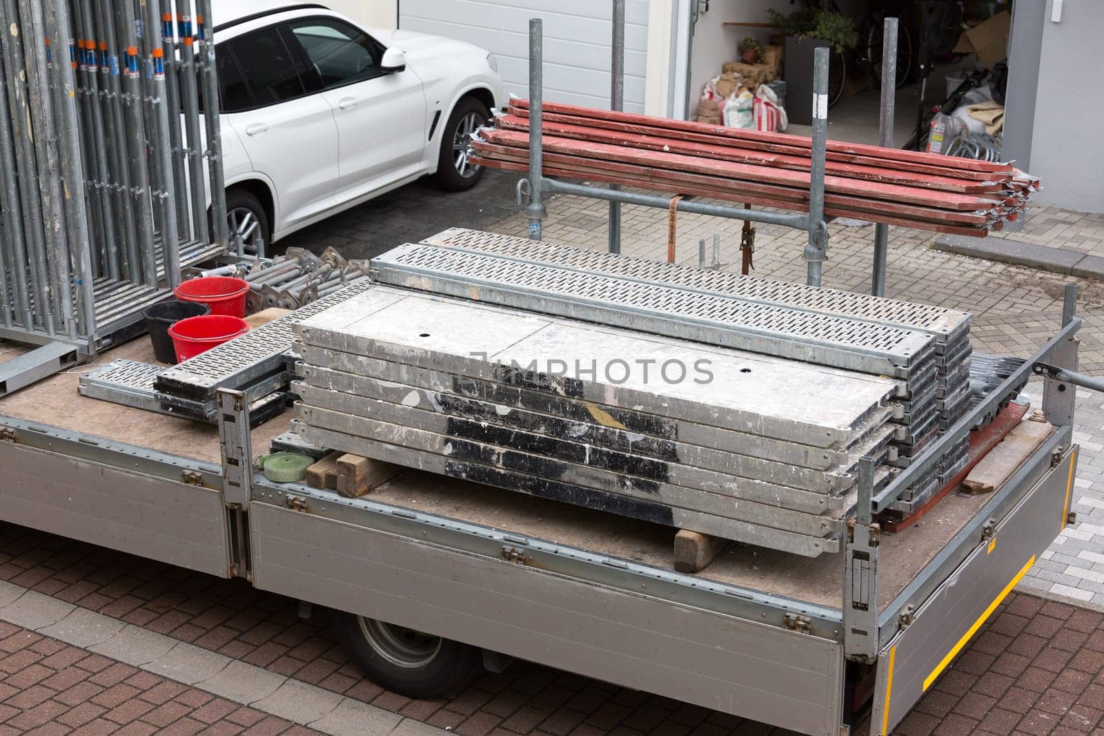 Small trailer transporting construction material for building a new house or reconstruction