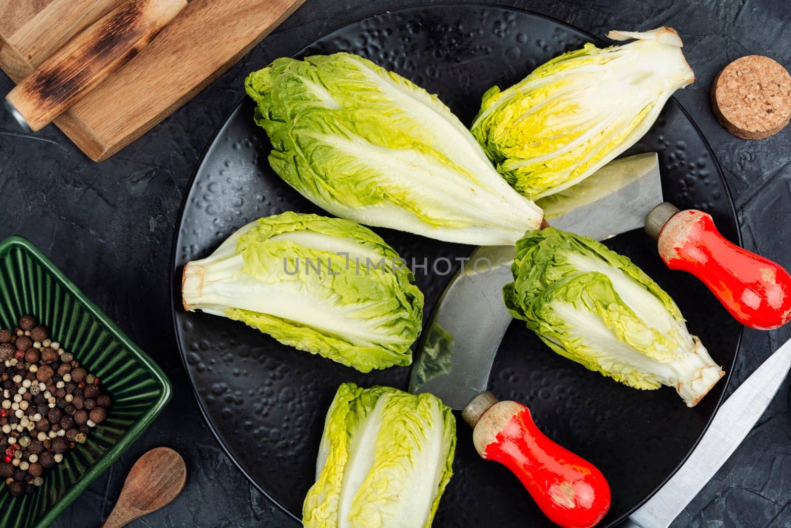 Raw green Romaine lettuce hearts. Baby cos lettuce leaves.