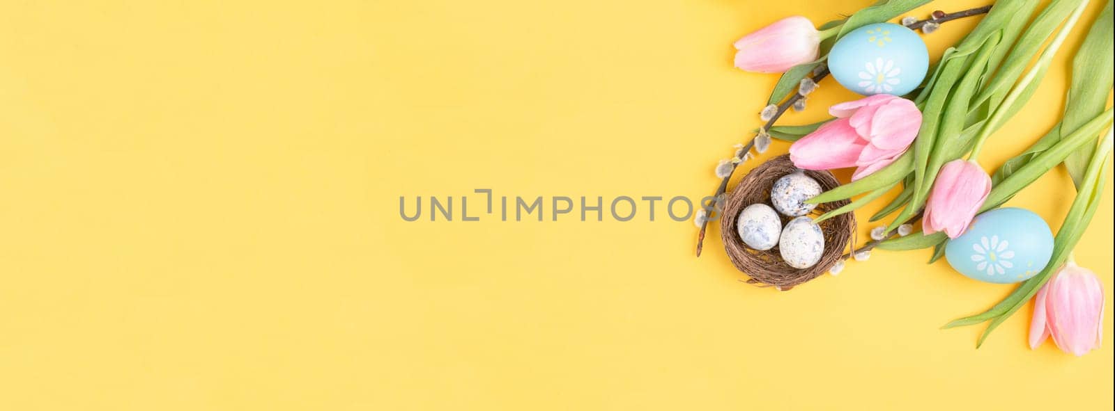 Nest with small eggs, pink tulips, easter holiday greeting card, spring season