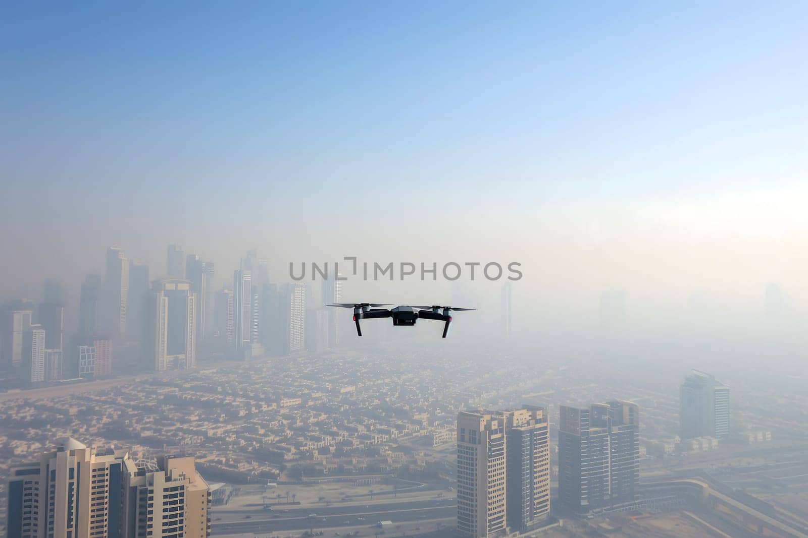 Flying drone above the city at summer morning. Neural network generated image. Not based on any actual scene or pattern.