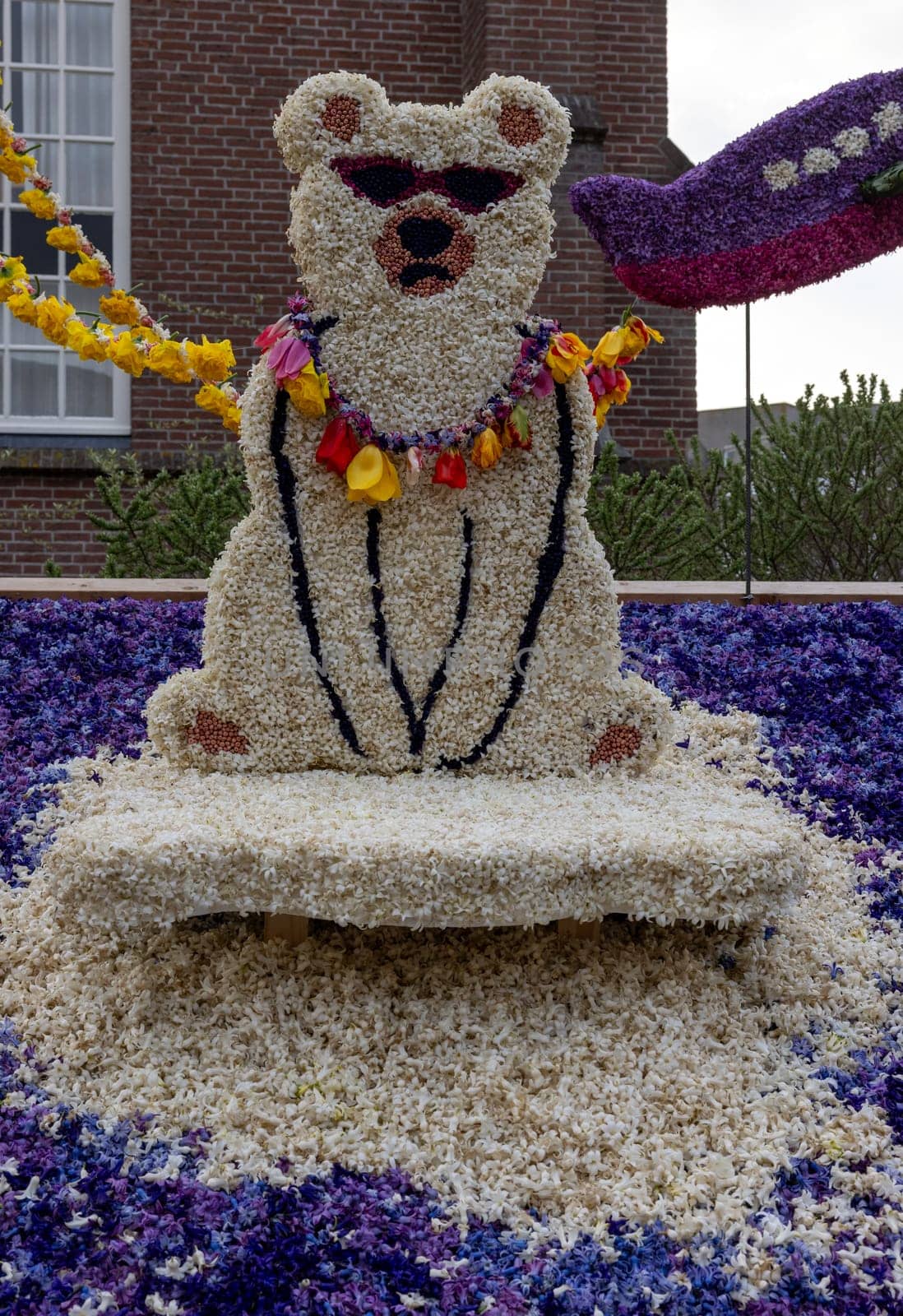 Noordwijkerhout, Netherlands - April 21, 2023: Panda bear made of white hyacinths presented before the evening illuminated Flower Parade Bollenstreek in Noordwijkerhout