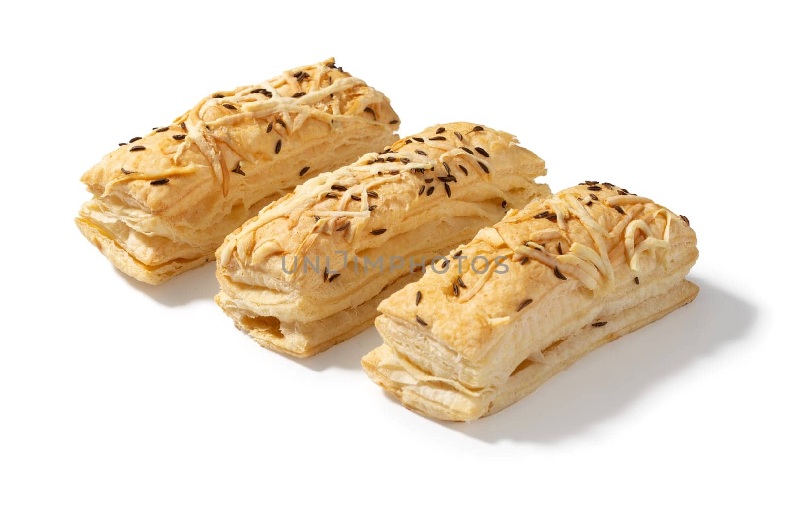 Three golden-brown crackers, each topped with a sprinkle of savory cheese