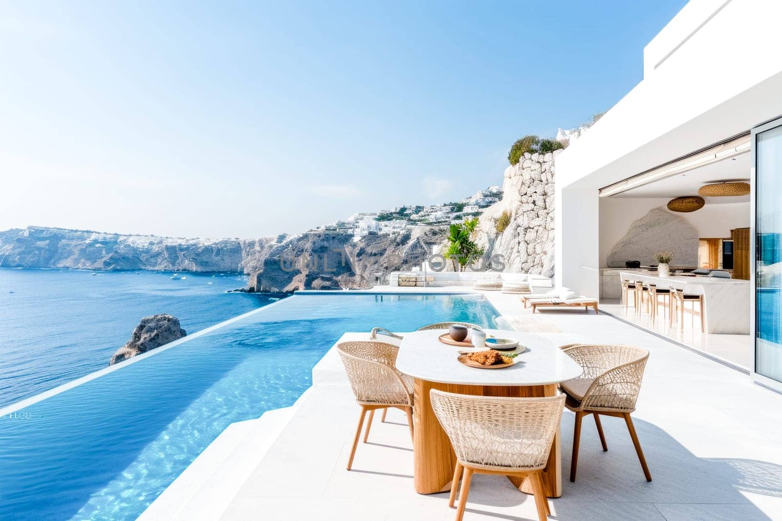 A modern cliffside villa with an infinity pool overlooking the sea. Copy space