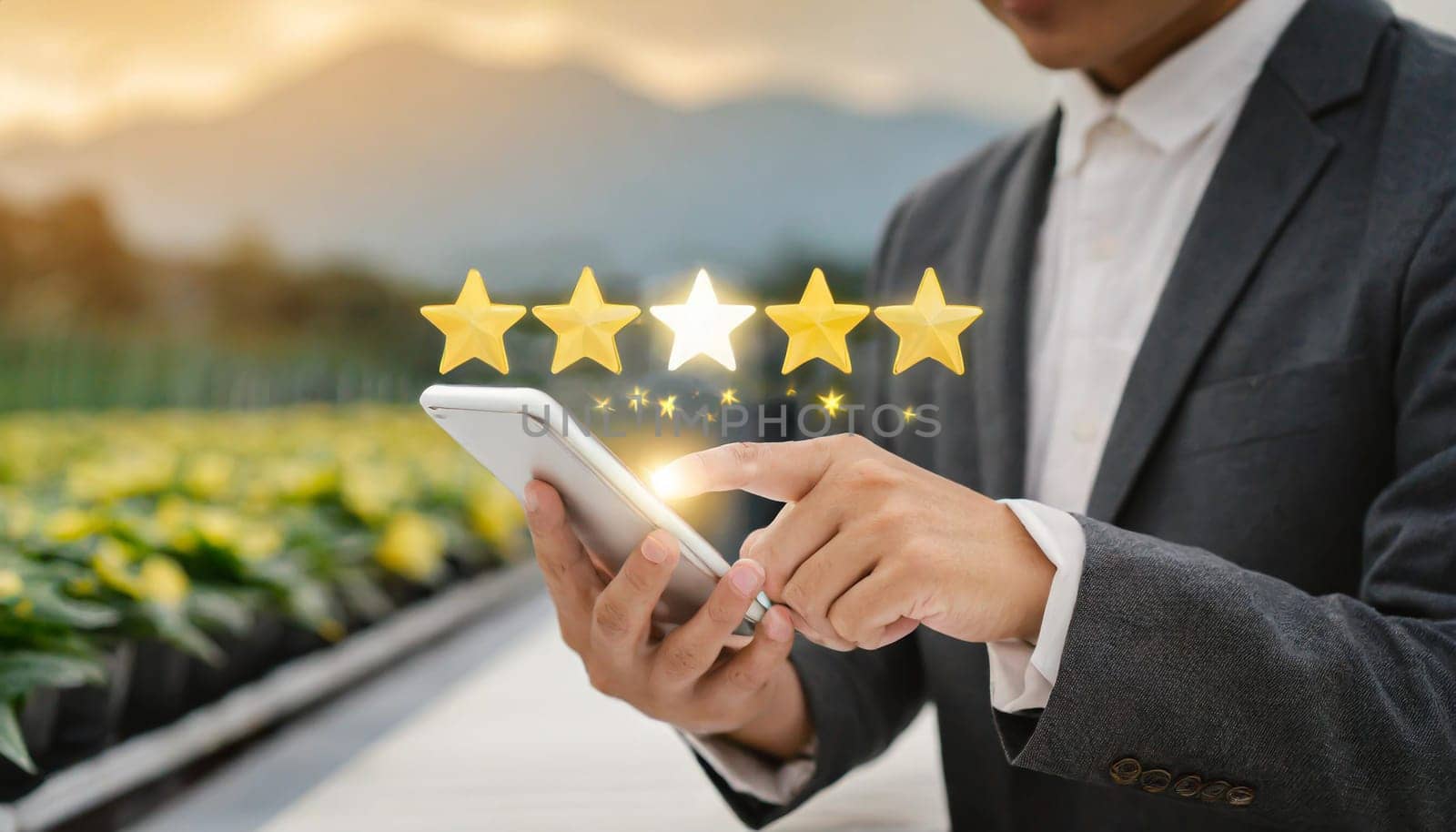 close up on customer man hand pressing on smartphone screen with gold five star rating feedback icon and press level three rank (good) for give score point to review the service business concept