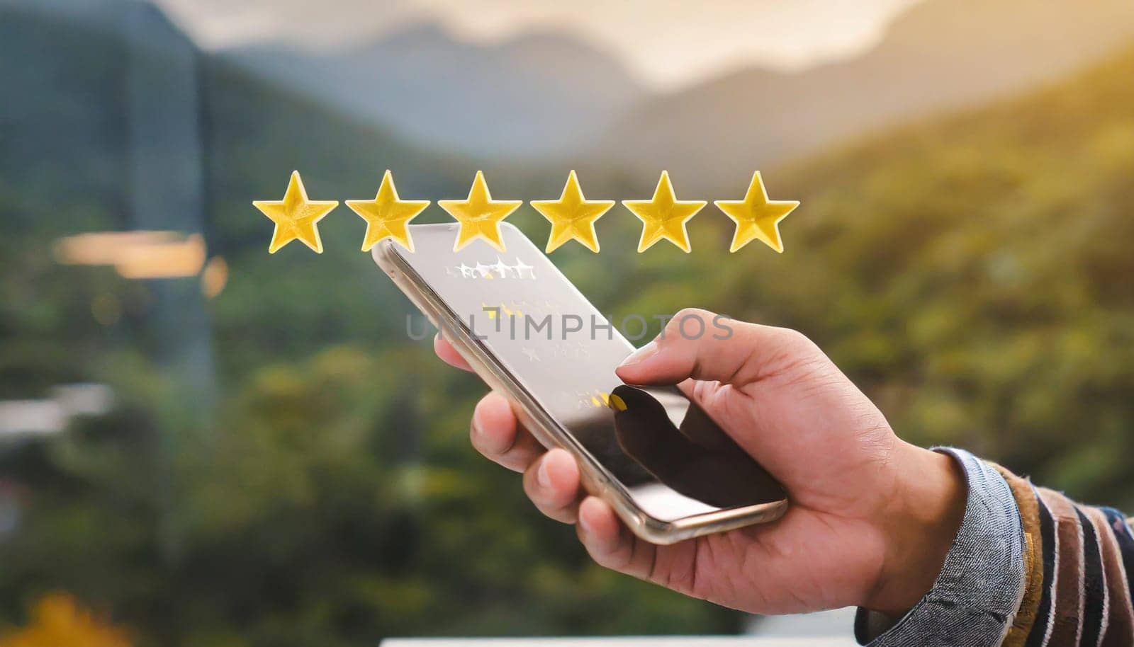 close up on customer man hand pressing on smartphone screen with gold five star rating feedback icon and press level three rank (good) for give score point to review the service business concept