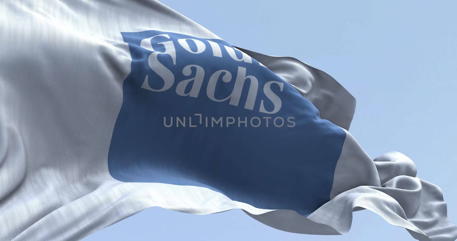New York, US, Mar. 2 2024: Goldman Sachs bank flag waving on a clear day. Illustrative editorial 3d illustration. Finance and banking. Selective focus