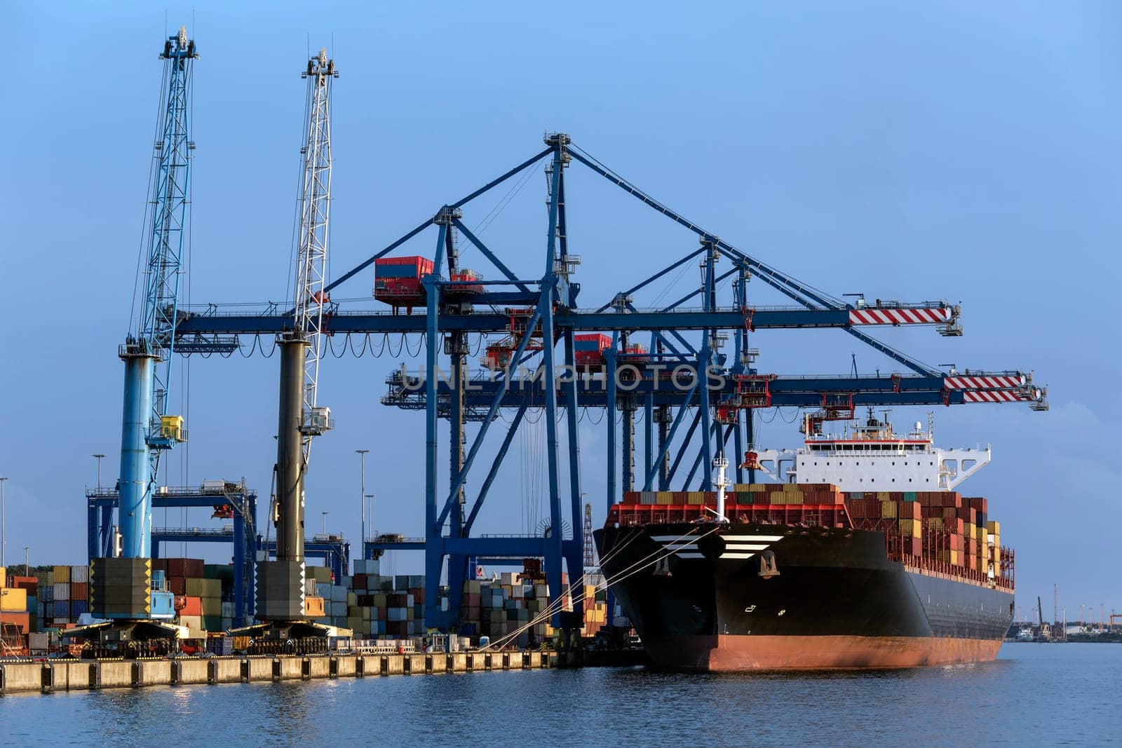 A large container ship unloading in the port of Klaipeda in Lithuania.