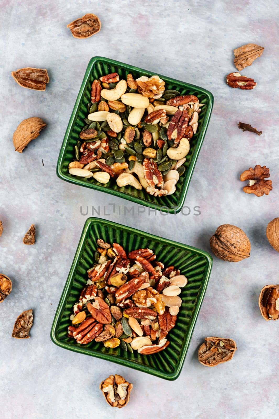 Mix of various nuts, pistachios, cashews, walnuts, peanuts and brazil nuts. Top view.