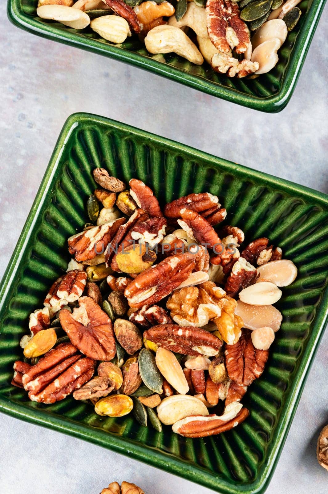 Mix of various nuts, pistachios, cashews, walnuts, peanuts and brazil nuts. Top view.