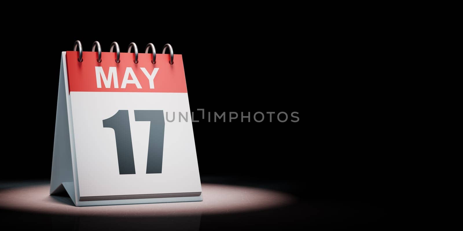 Red and White May 17 Desk Calendar Spotlighted on Black Background with Copy Space 3D Illustration