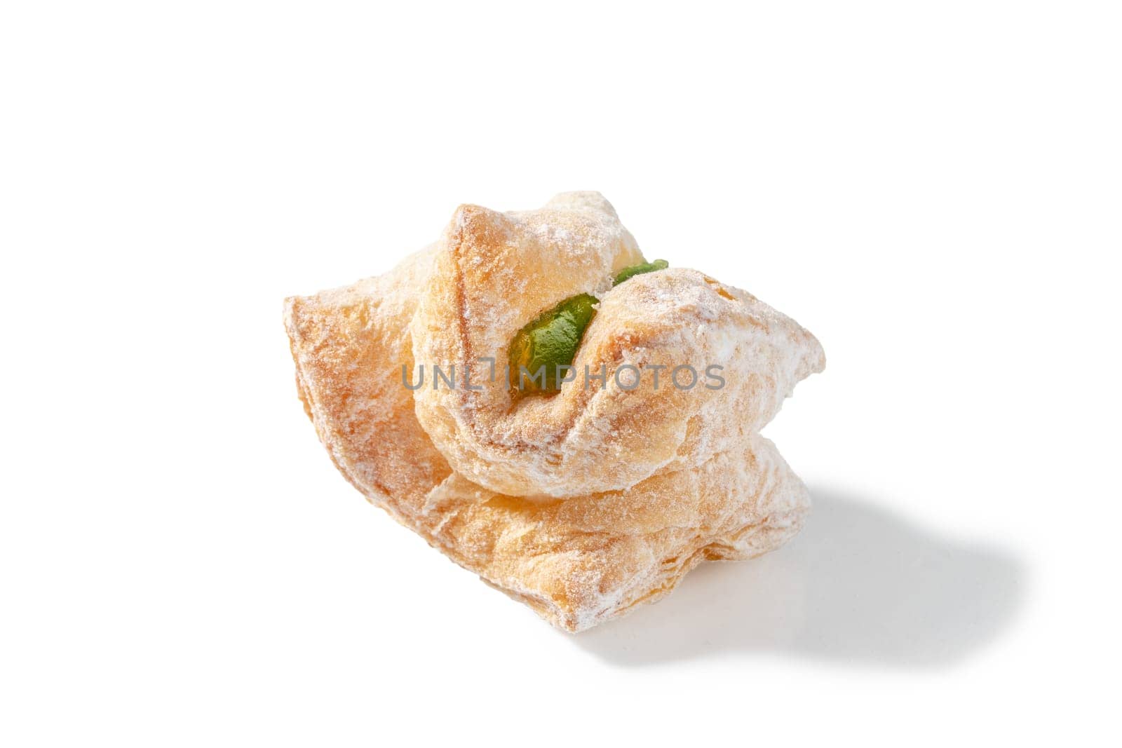 A delightful treat featuring flaky puff pastry filled with green Turkish Delight and dusted with a veil of powdered sugar