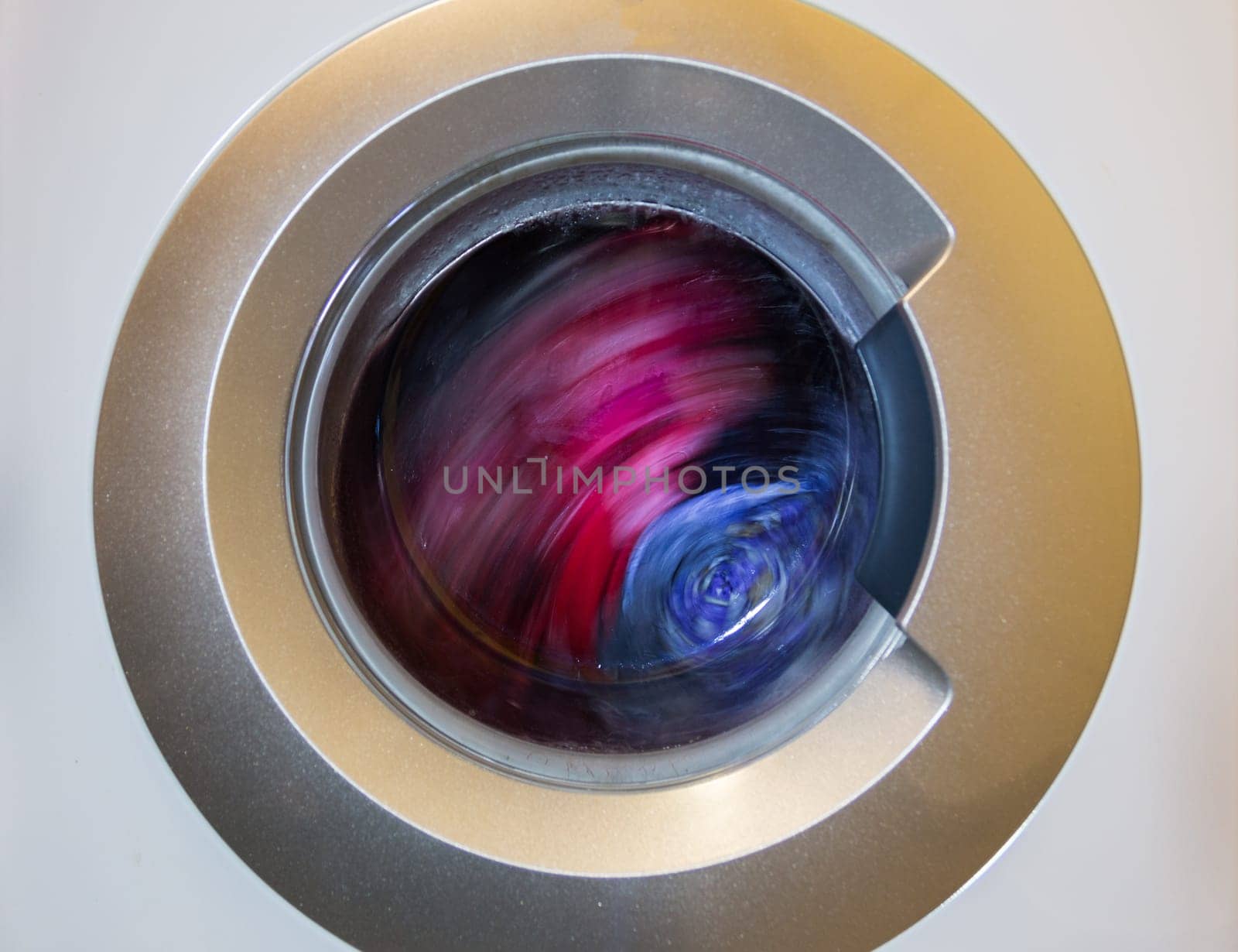 a close view of domestic washing machine at work.