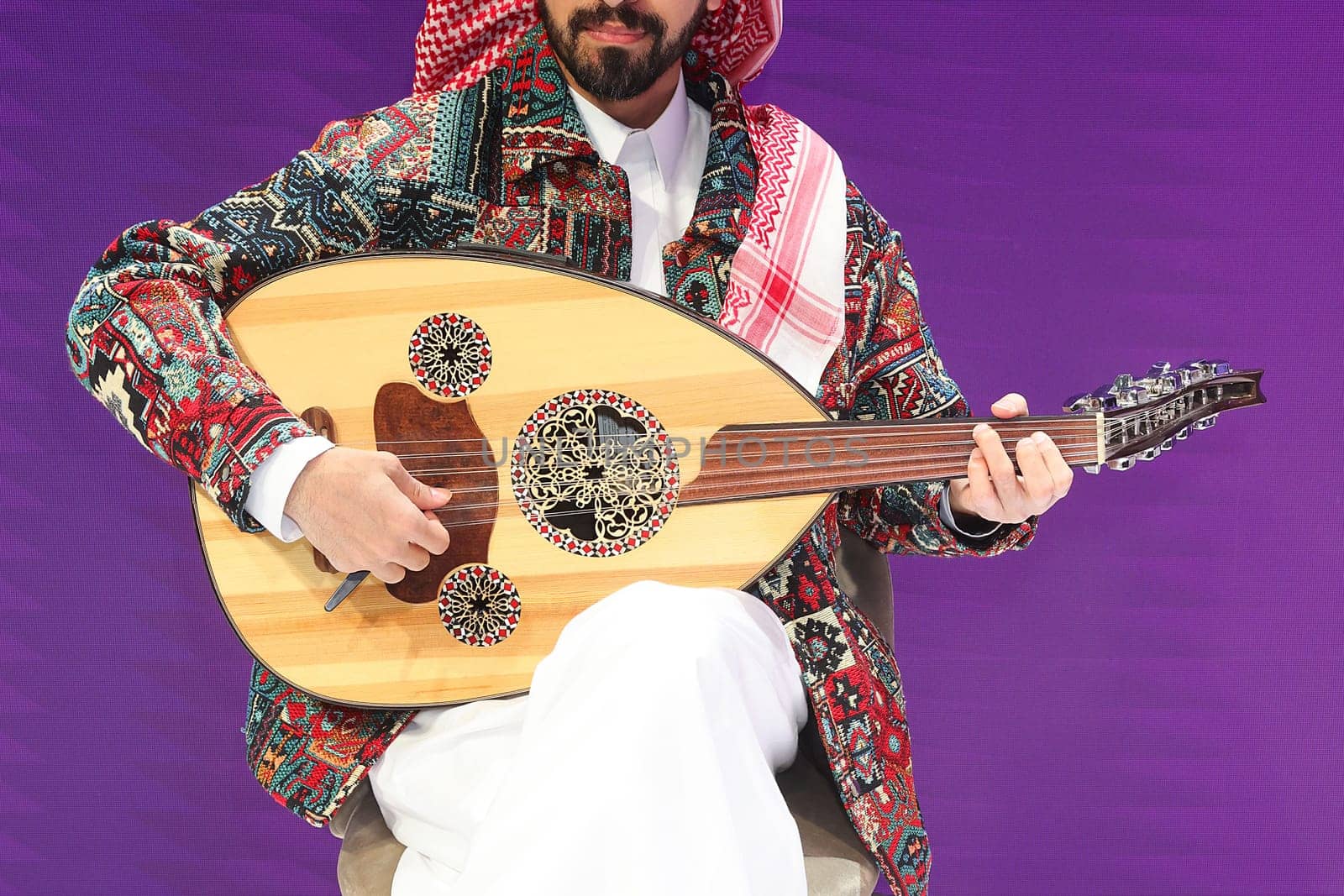 A musician playing an oud