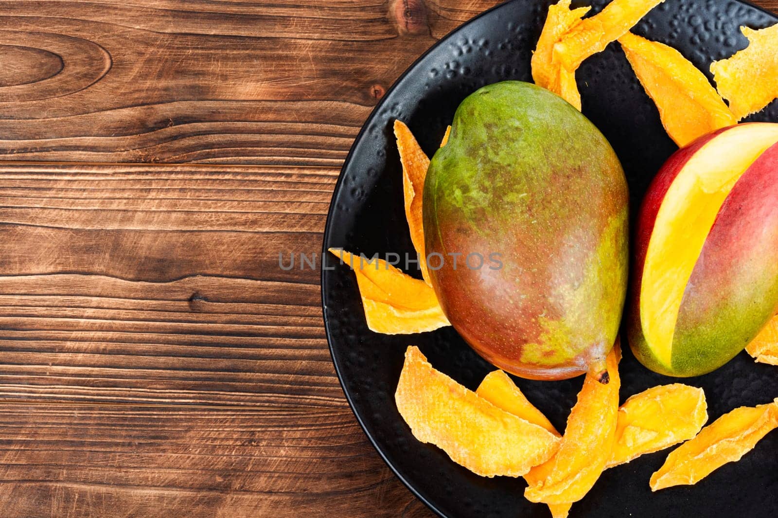 Dried and fresh mango fruit. Superfood, vegan or vegetarian. Copy space.
