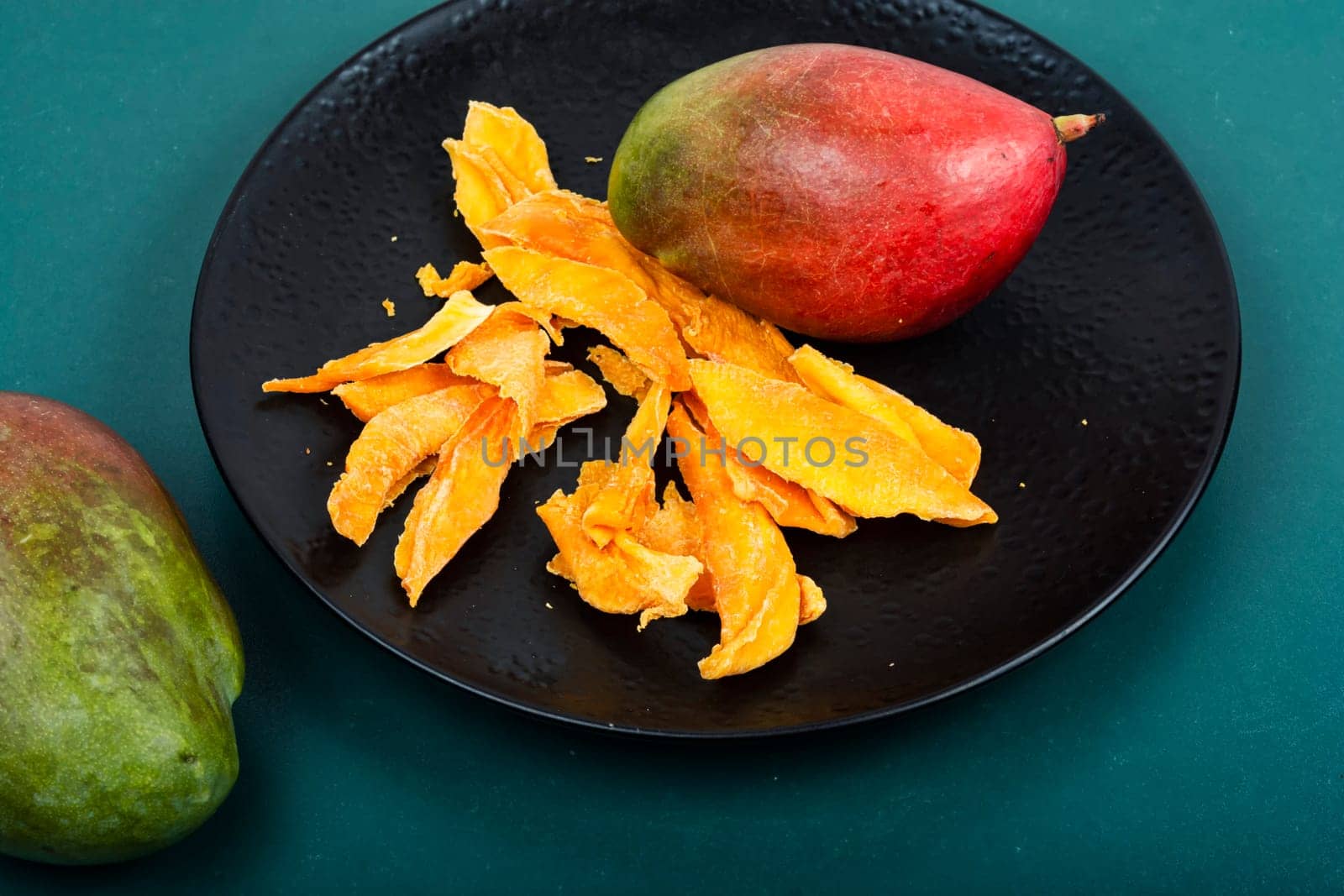 Dried and fresh mango fruit. Superfood, vegan or vegetarian.