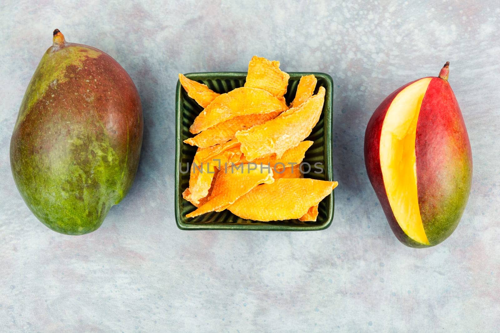 Dried and fresh mango fruit. Superfood, vegan or vegetarian.